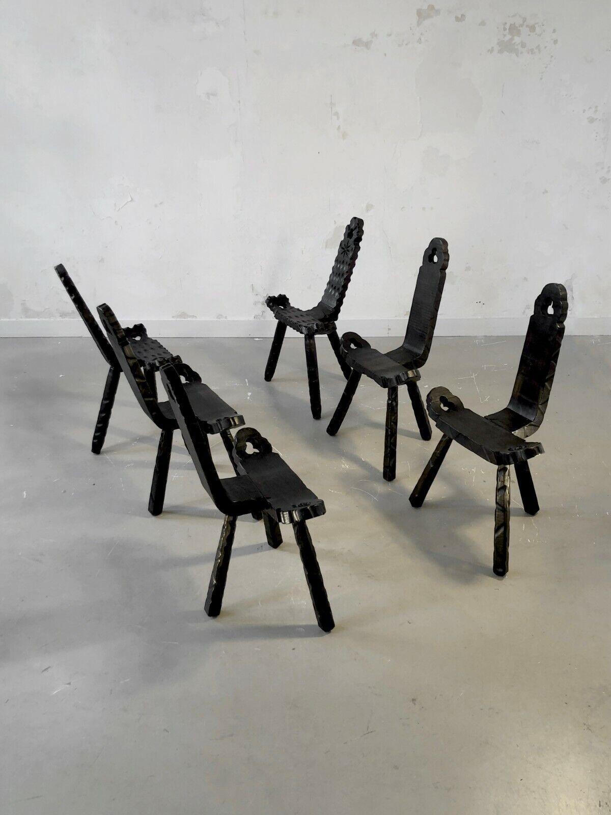 A set of 6 surprising tripod chairs, Modernist, Brutalist, Folk Art, Tribal Art, sculpted in massive wood, with beautiful floral organic motifs, to be attributed, France 1950.

This set is a beautiful demonstration of the resources and formal
