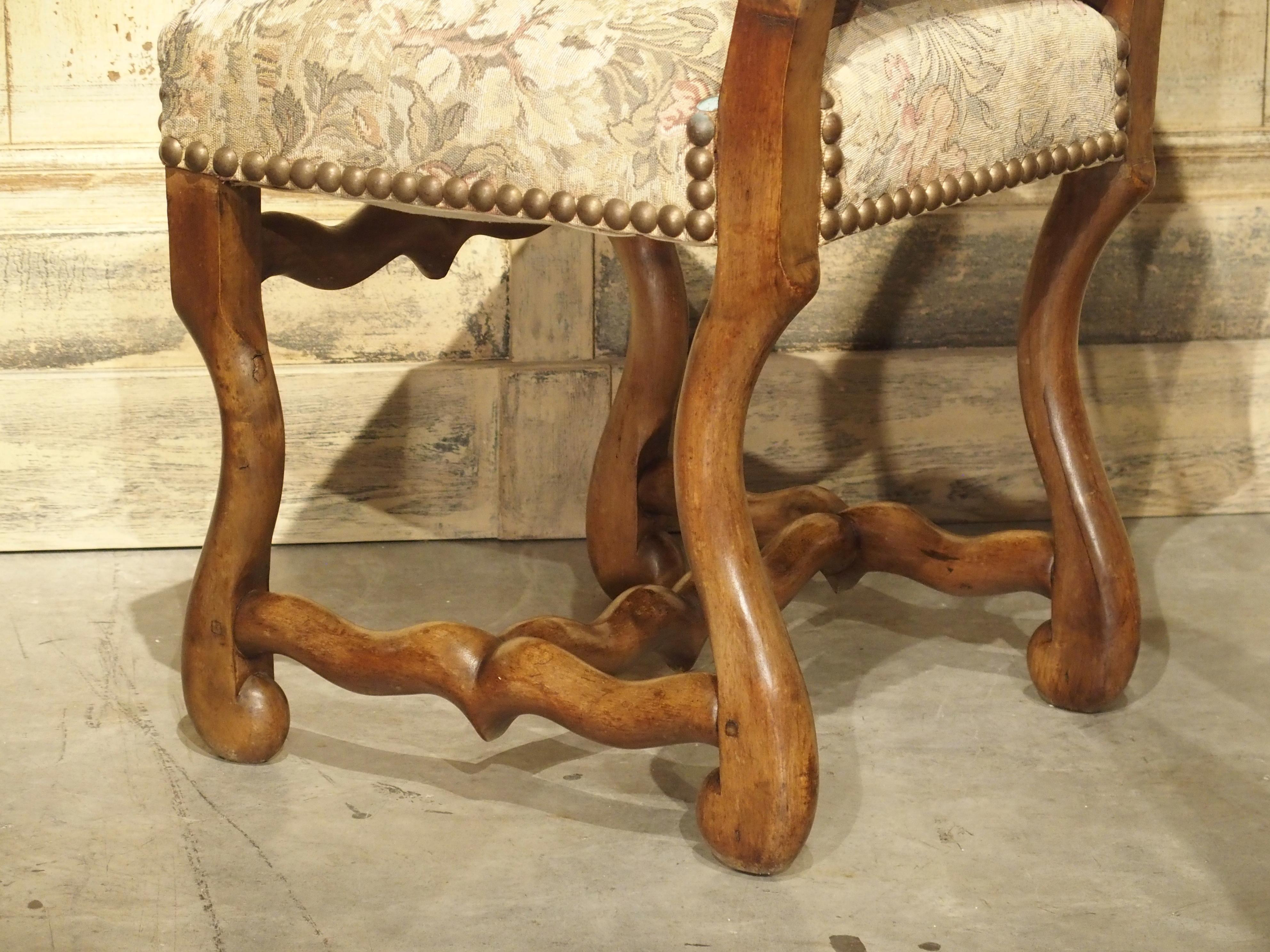 This set of six Classic French Os de Mouton side chairs have been hand carved in beech wood, assembled with square peg construction and upholstered with a floral print. French Beech is a pretty wood, but also very strong, which made is a preferred