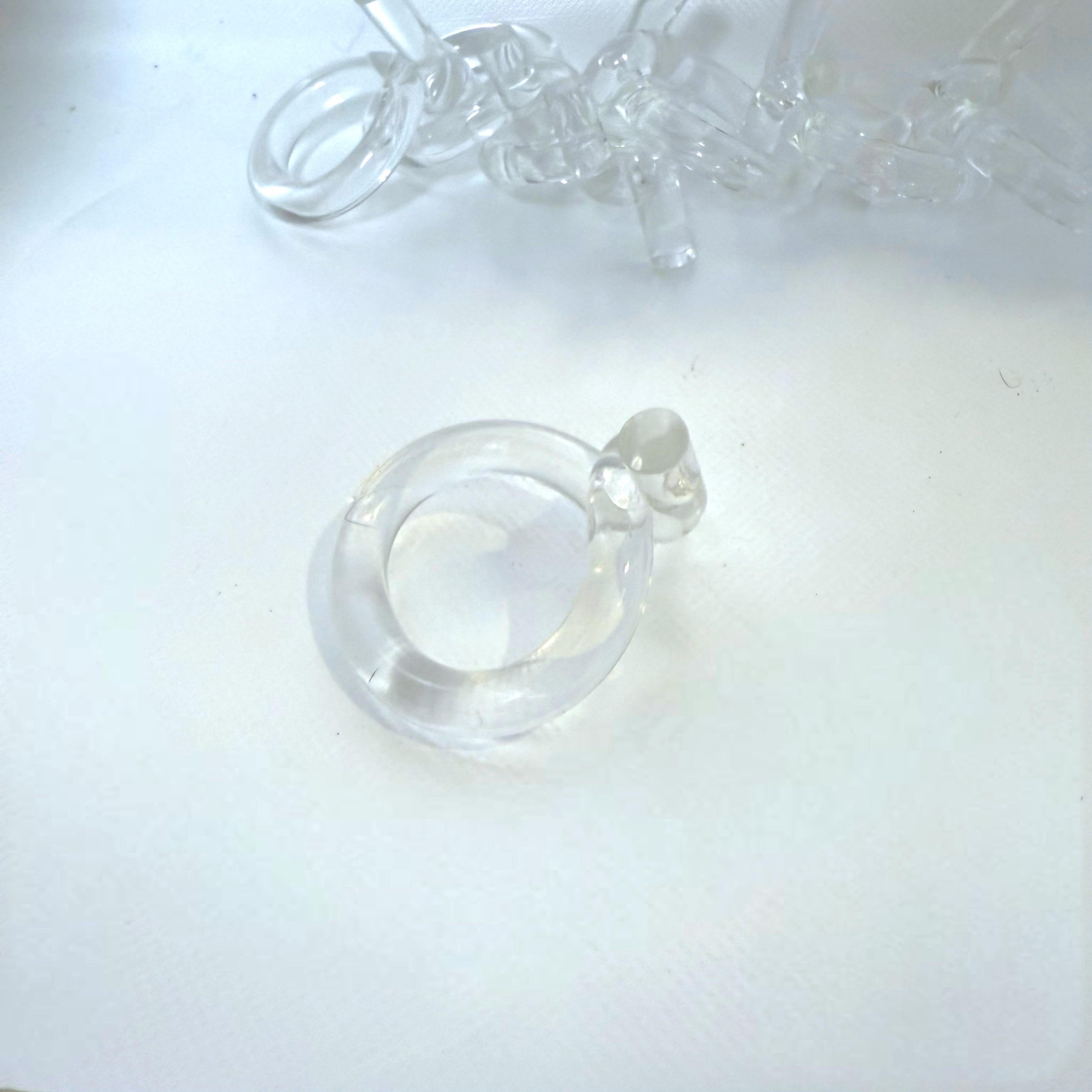 A set of 6 sculptural lucite napkin rings in the manner of Georg Jensen.  Similar to the popular “pretzel” napkin rings realized by Dorothy Thorpe.   These are round and have a little twisty tie shape at the top.  Another lucite for the win!   These
