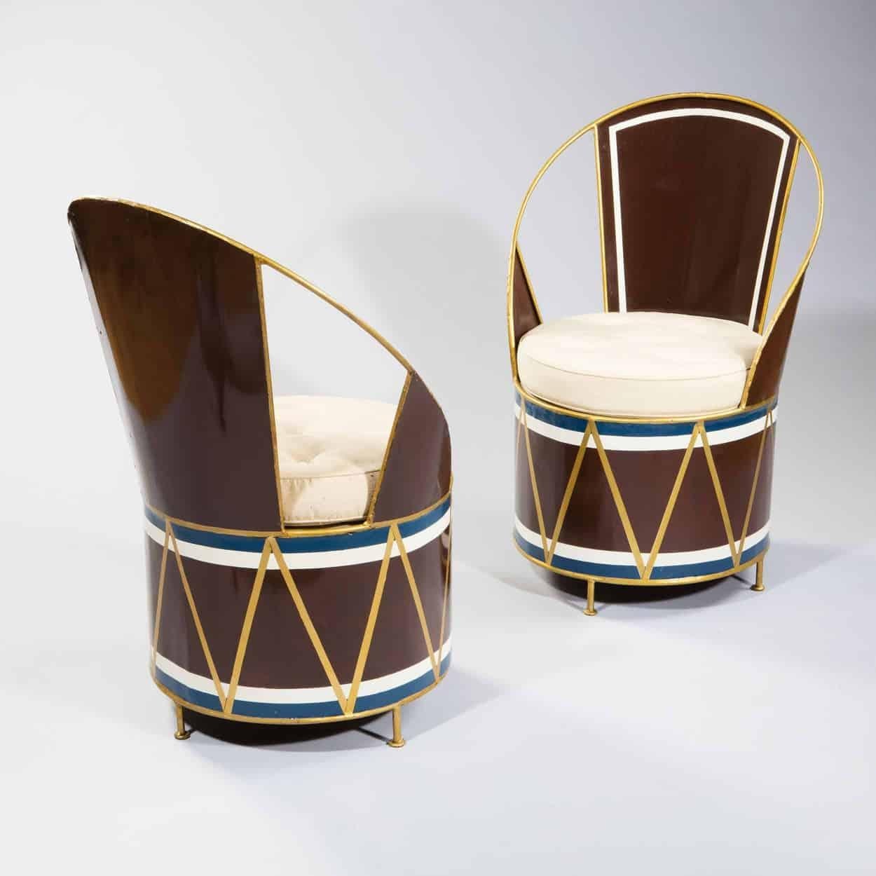 France, circa 1940

A set of 6 modernist tole cafe chairs decorated on a brown ground with the stylized decoration of a military drum, the back and feet in oil gilt.

Measures: Height 35 in (88 cm), width 22in (56 cm).