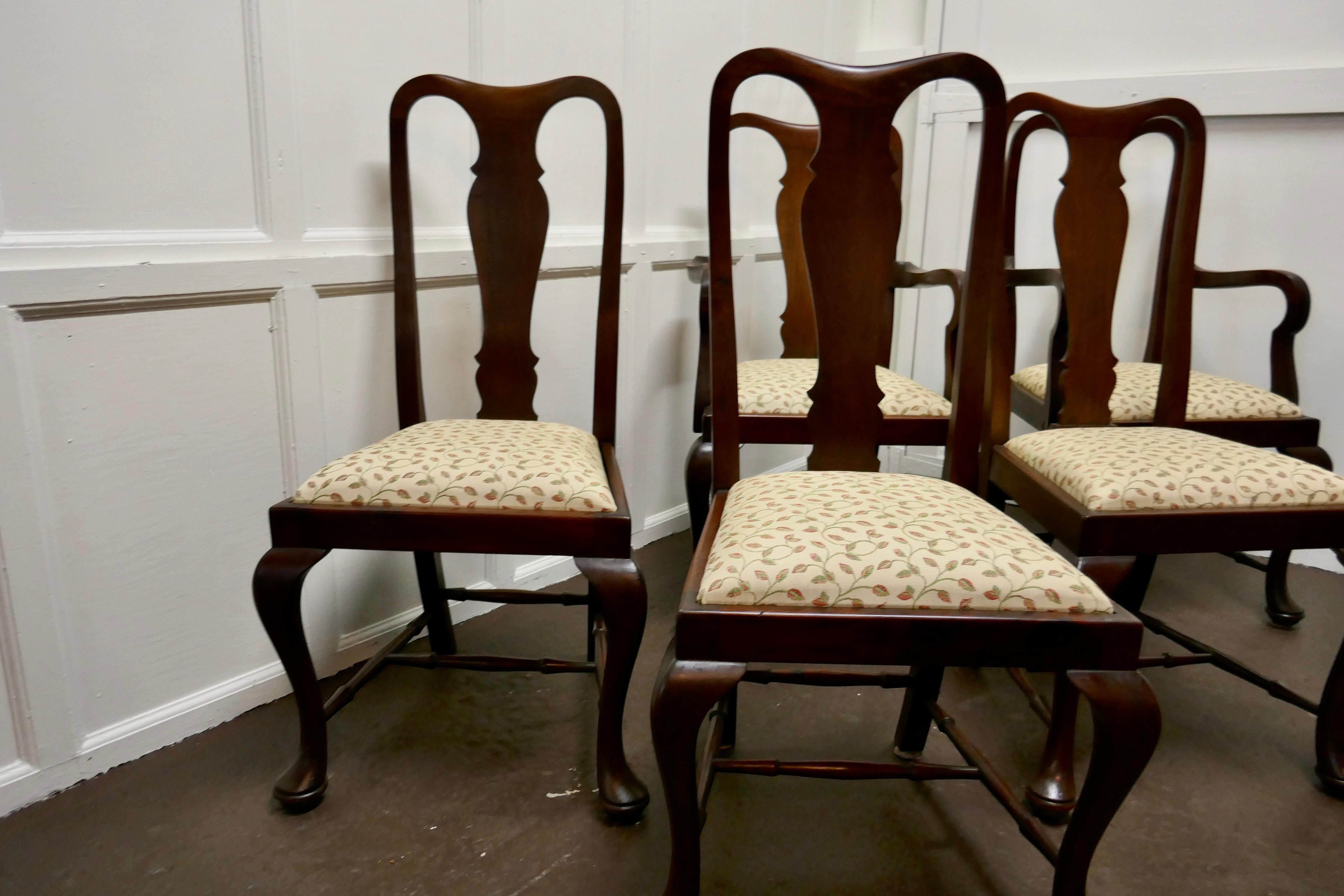 A set of 6 Queen Anne style mahogany dining chairs

A lovely looking set.
The chairs are a Classic design and made in mahogany they have a solid back splat, with cabriole legs and shepherd’s crook arm rests, they are roomy and comfortable, the