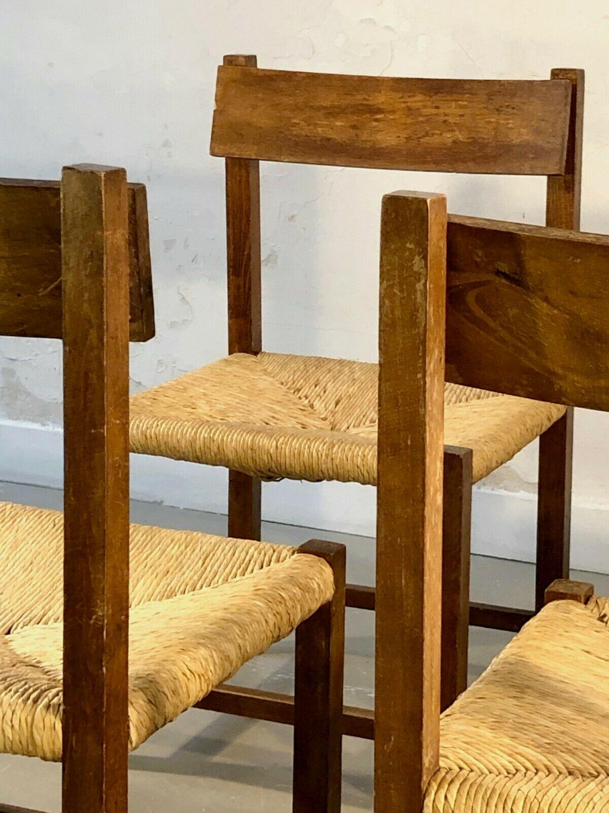 A set of 6 rigorous geometrical chairs, Modernist, Brutalist, Constructivist, with geometrical wooden structures of cubic section, straw seats, the backrest being slightly shifted from the structure giving a beautiful asymmetrical effect and the