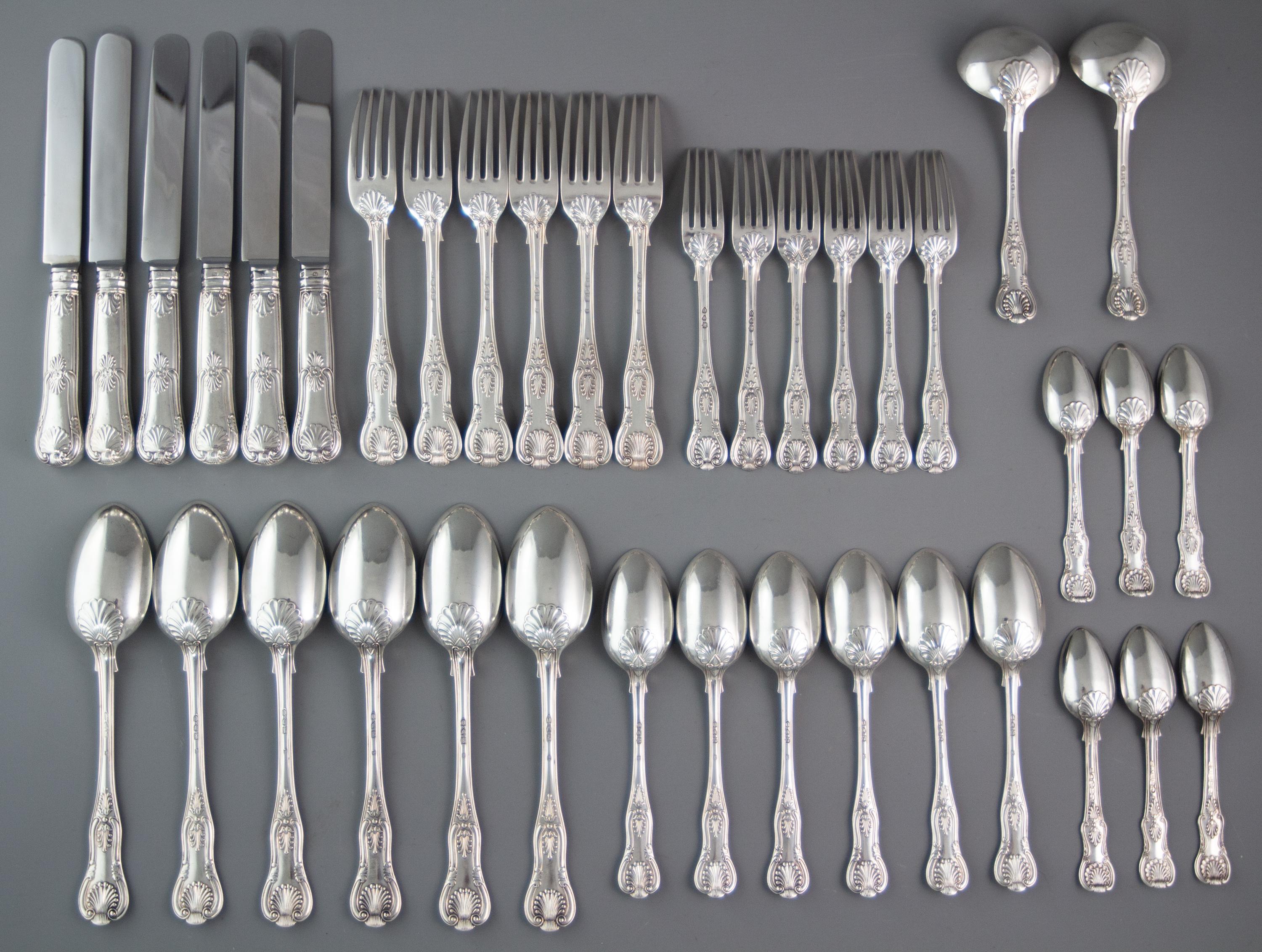 An extremely good set of Kings pattern Victorian silver tableware for six people consisting of six dinner or table forks, six dessert forks, six dessert spoons, six serving or tablespoons, two sauce ladles, six teaspoons and six table knives.

