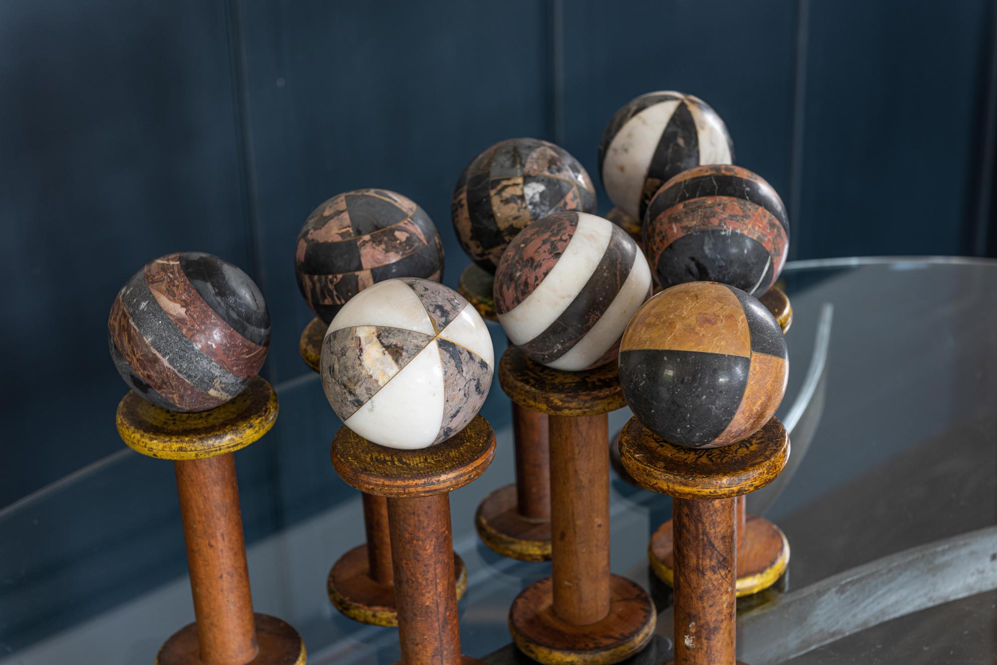 A set of 8 decorative French early 20th century marble spheres balls.