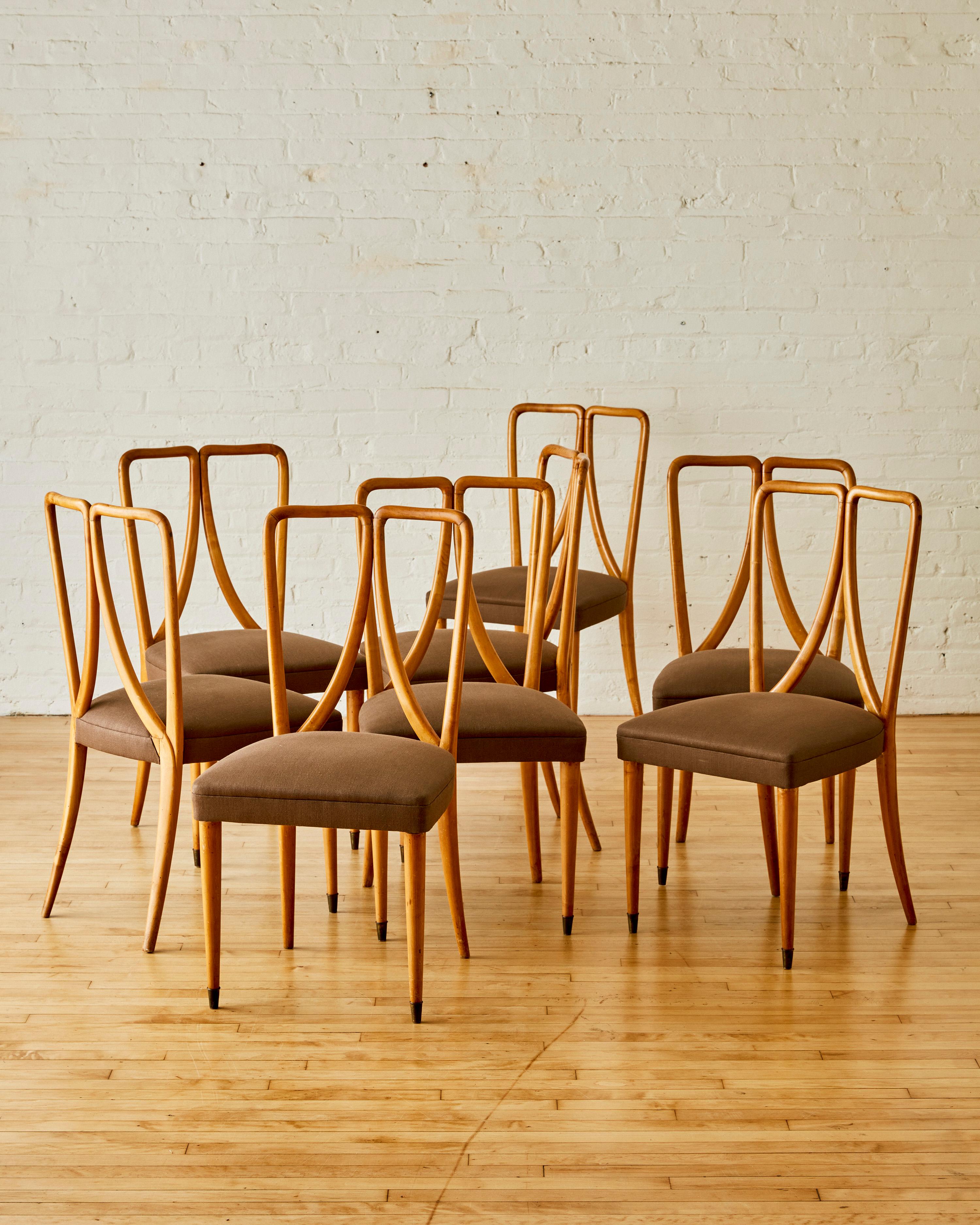 A set of 8 fruitwood dining chairs by Guglielmo Ulrich with an irregular open backrest, Newly reupholstered in Linen

Guglielmo Ulrich (born 1904, Milan–died 1977) was an Italian architect, furniture designer, and painter. He was born to a notable