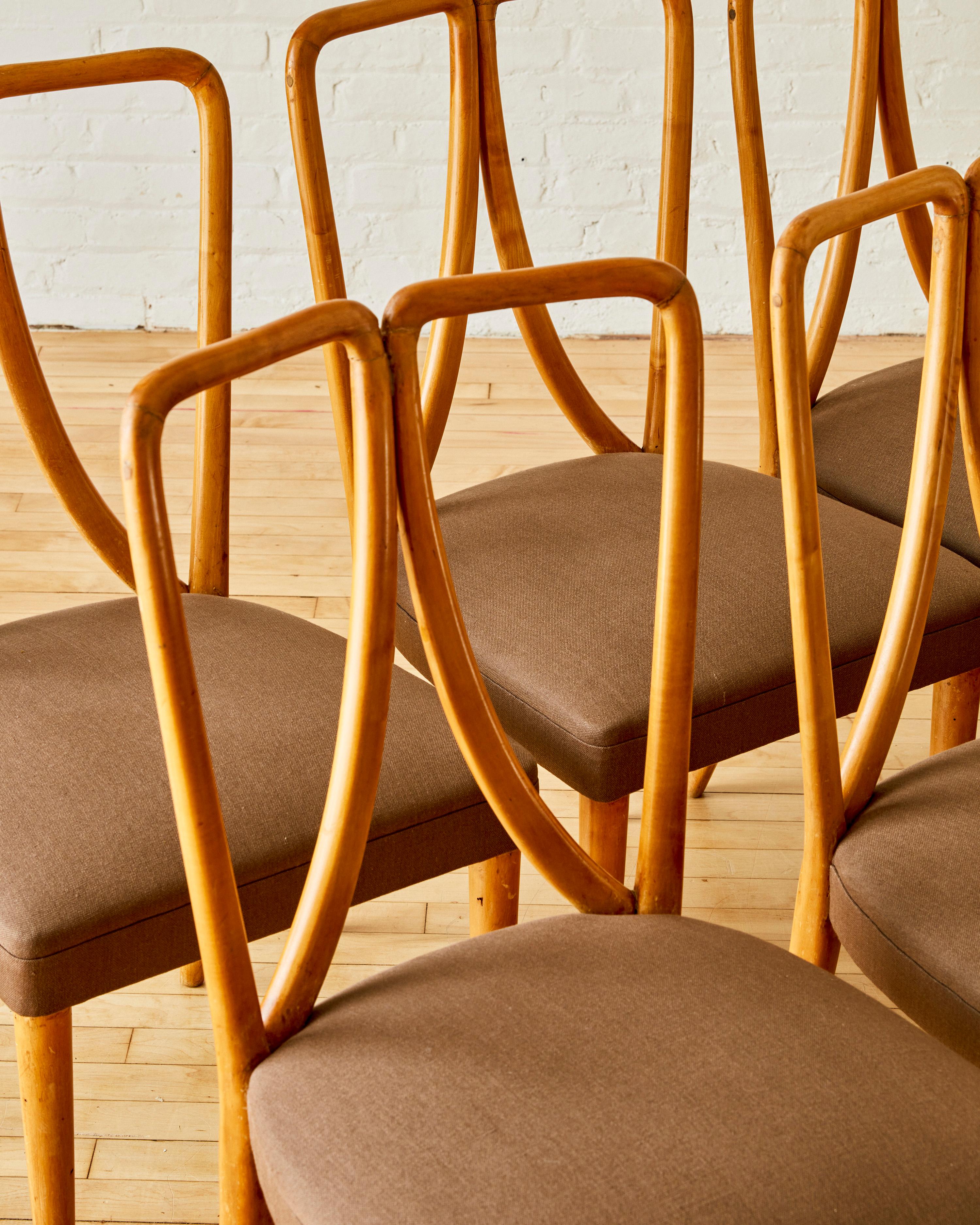 Linen  A set of 8 fruitwood dining chairs by Guglielmo Ulrich For Sale