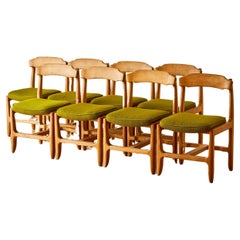 A set of 8 Oak Dining Chairs by  Guillerme & Chambron