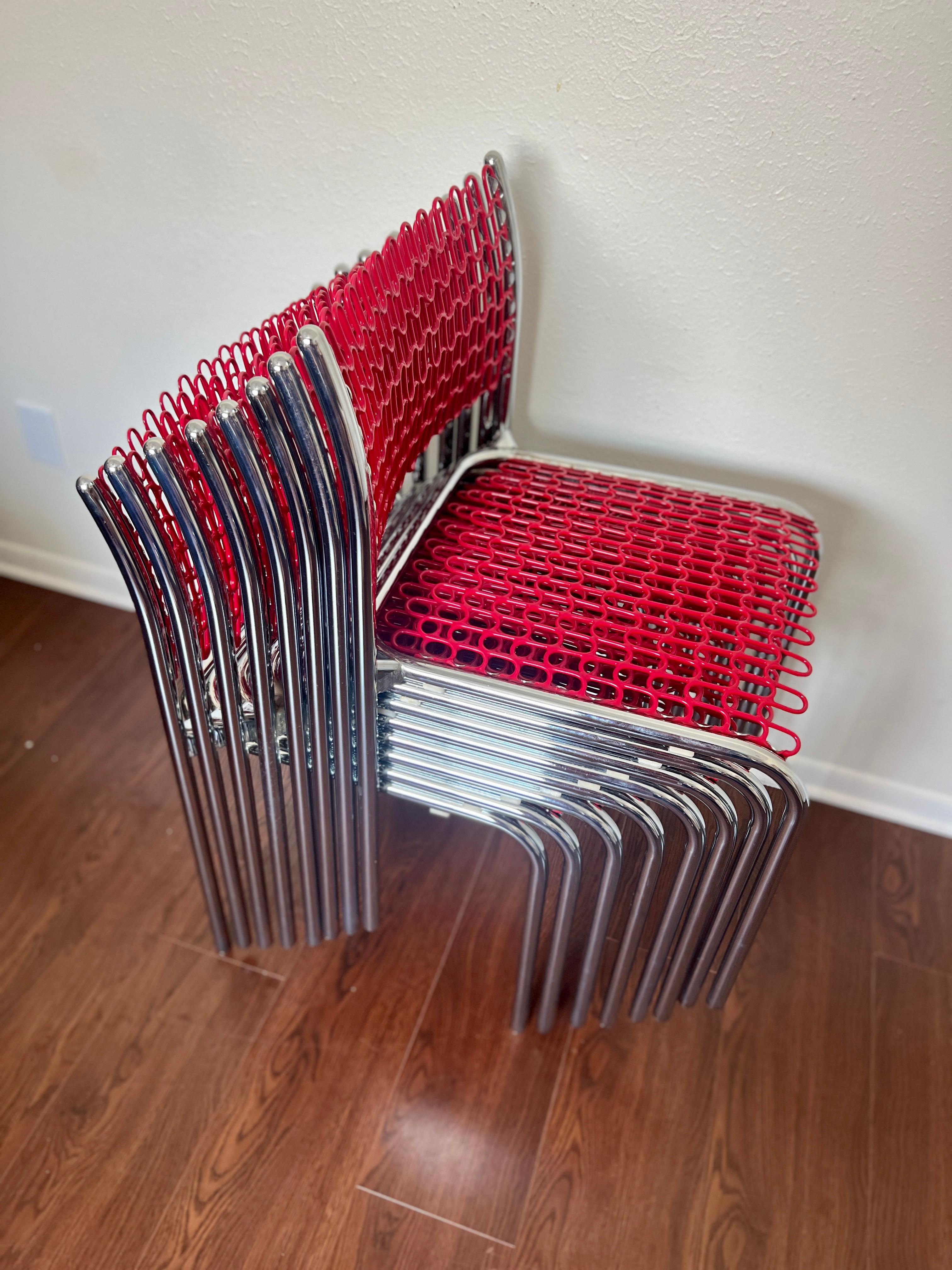 A set of 4 Sof-Tek stacking chairs by David Rowland for Thonet circa 1970s. In the original bright red vinyl on tubular chrome frames. These can be used indoor or outdoor. Manufacturing label still intact. The chairs are in very good vintage