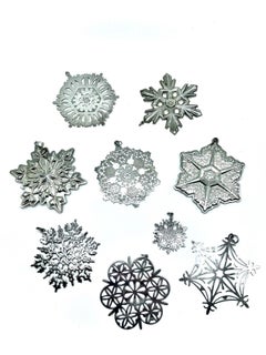 Set of 9 American Sterling Silver Christmas Snowflake Ornaments