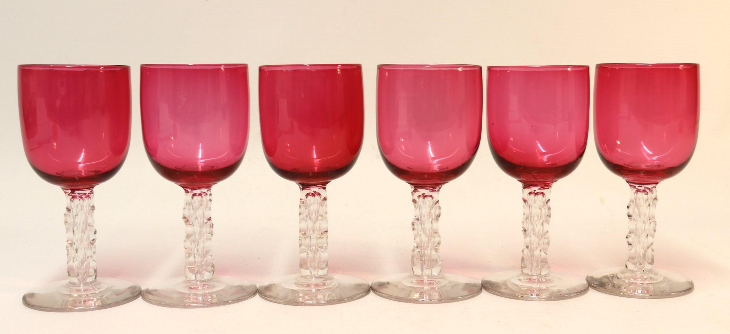 A set of six elegant Victorian goblets with ruby glass bowls on clear cut glass stems and foot.
These goblets are in perfect condition.