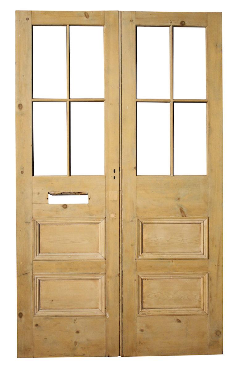 A set of external double doors with a natural wood finish.