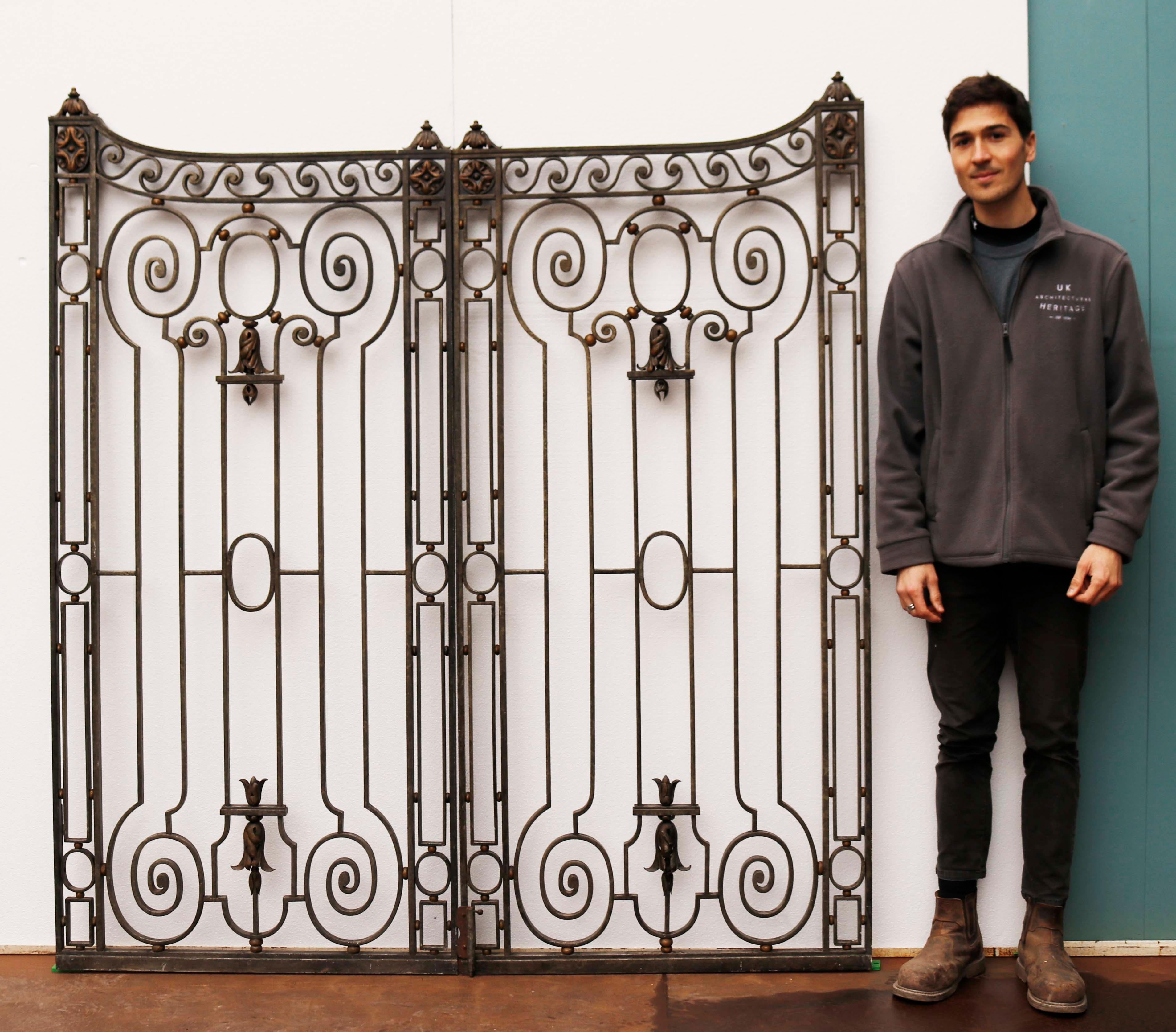 Antique neoclassical style Pedestrian gates. A set of English wrought iron gates. The gates have been reclaimed from a grand London building, where they were fitted internally and painted to simulate bronze.

Additional dimensions

Height at the