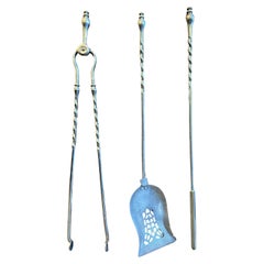 A Set Of Antique Polished Steel English Fire Tools