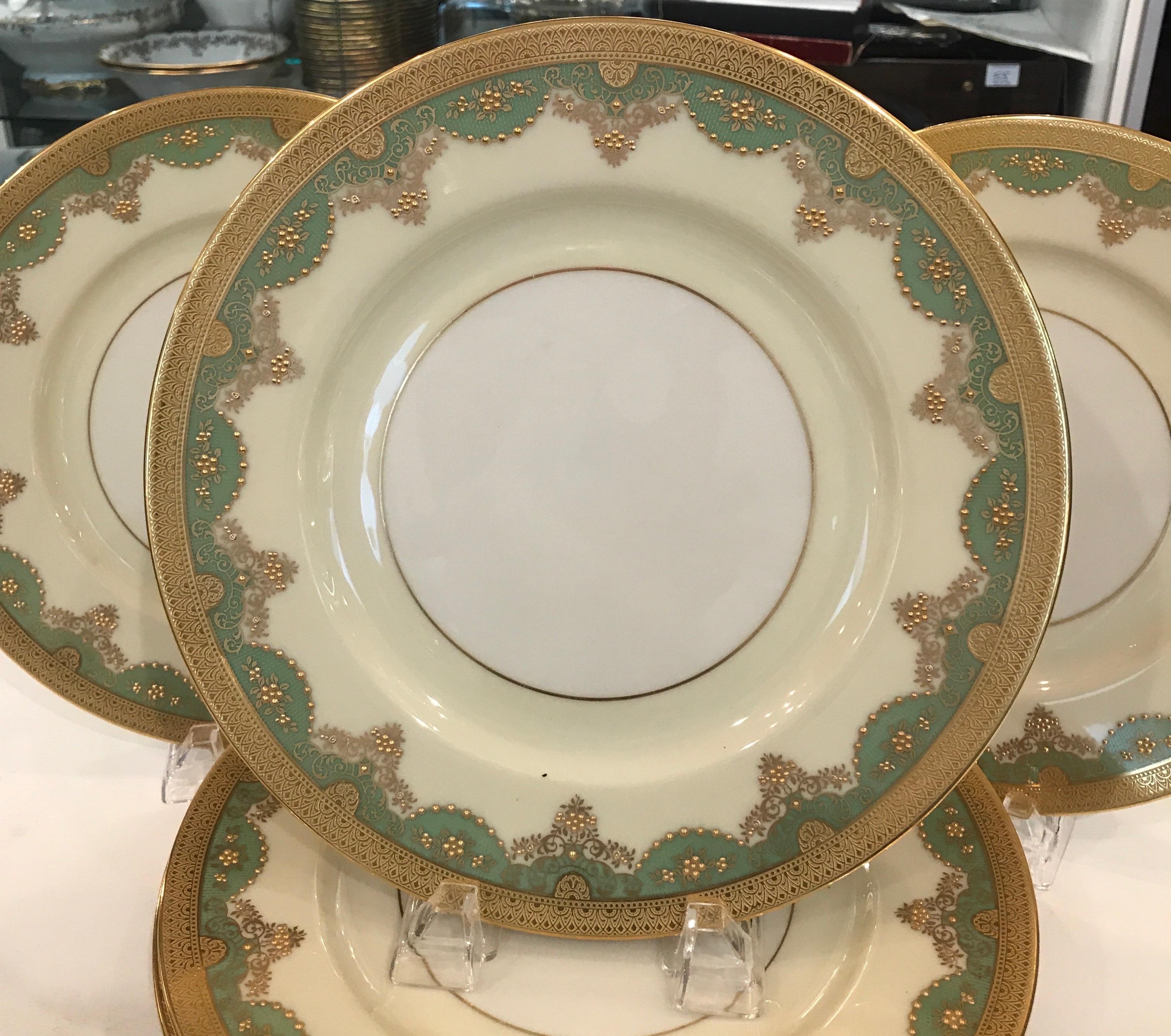 An elegant set of 12 raised gilt service dinner plates. The gold rims with a quince green highlighted with raised gilt beaded decoration. These plates with the pre 1930 Lenox green mark, Circa 1920... EXCELLENT Condition, 10.5 inches Diameter