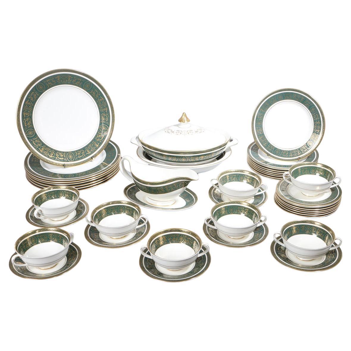 The Royal Doulton Carlyle (pattern H4992) is a sophisticated and highly recognizable china pattern featuring a rich teal or green border with a blue and gold floral motif. Produced from 1972 to 2001, its timeless, luxurious design makes it a popular