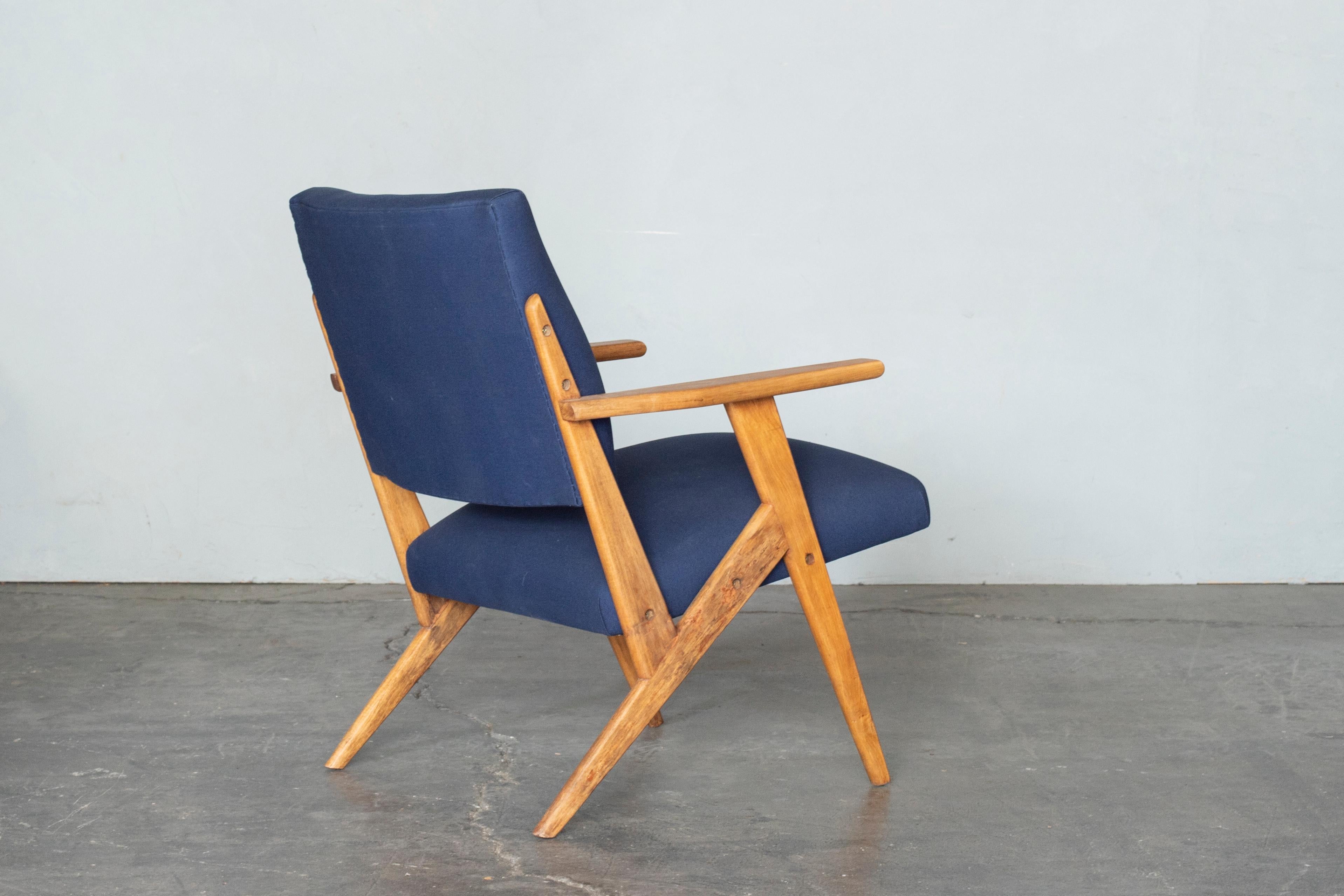 A set of armchairs designed by Jose Zanine Caldas for his studio 'Moveis Artisticos Z' in 1950.
Brazilian midcentury design.
Made with solid wood, reupholstered with blue fabric.
          
