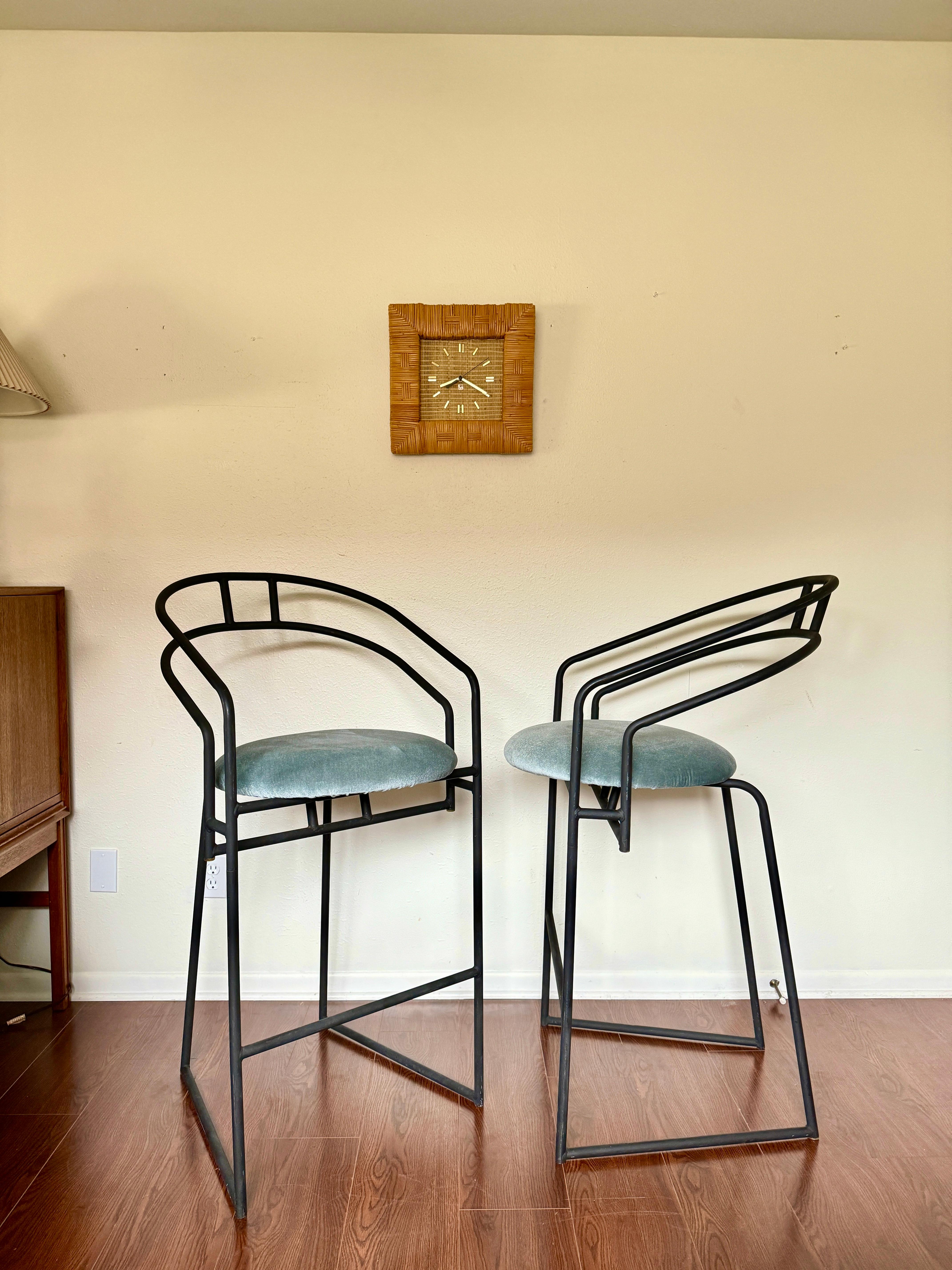 A set of Post Modern barstools by Cali-Style, circa 1980s. These feature black powder coat frames with newly reupholstered seat cushions. They have a sleek modern, minimalist design, and are in very good condition. 

43.5” H x 21.5” W x 24.5” D
Seat