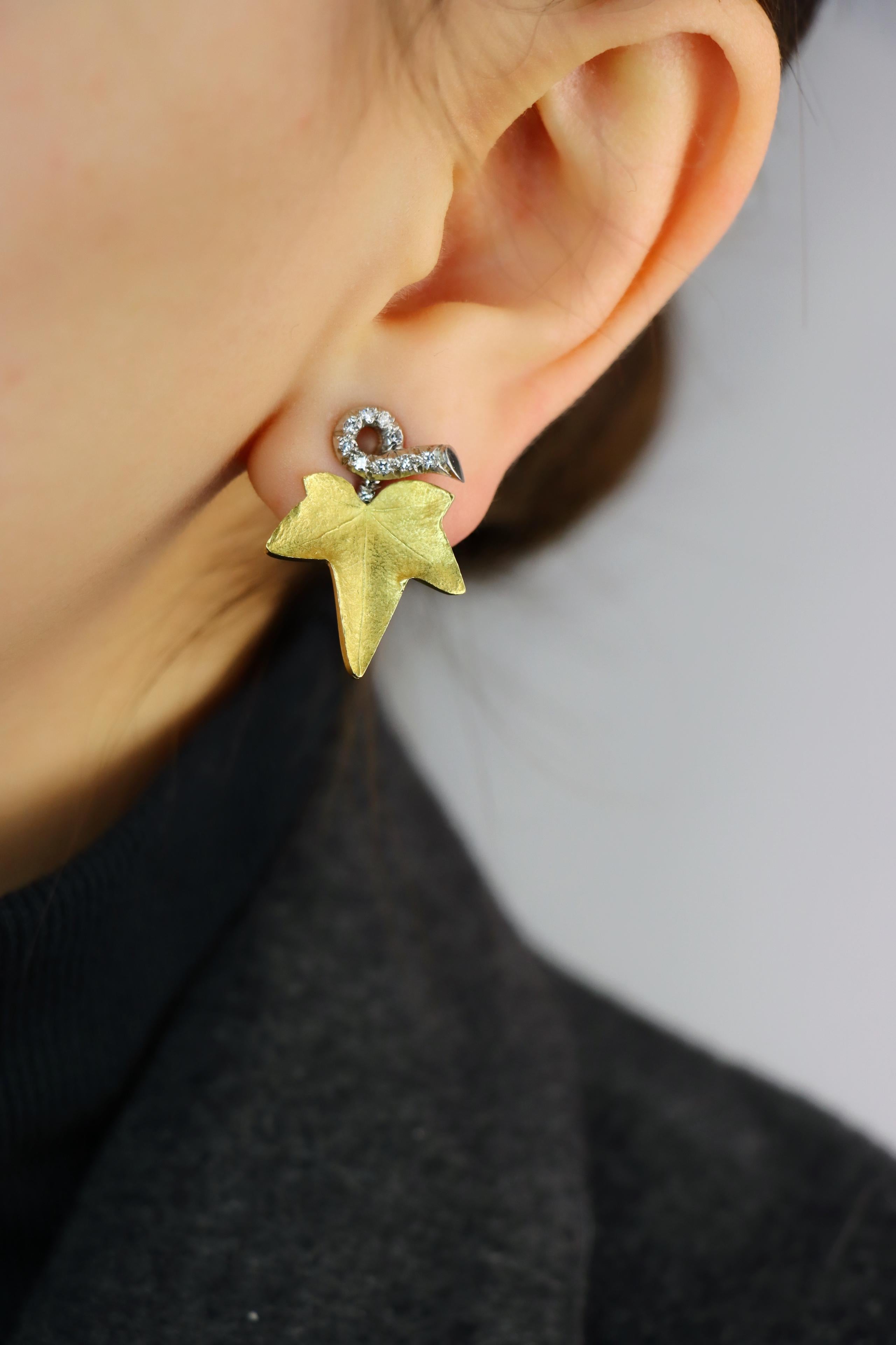 A set of Cartier 18K Gold Platinum Diamond Maple Leaf Earrings 

Marked:
CARTIER
18K

Approximate Dimensions:
2.6 cm ( Length)
2 cm (Width)
10.8 grams in weight.