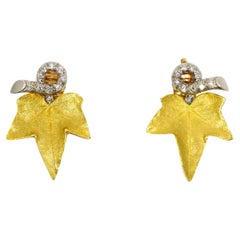 A set of Cartier 18K Gold Platinum Diamond Maple Leaf Earrings