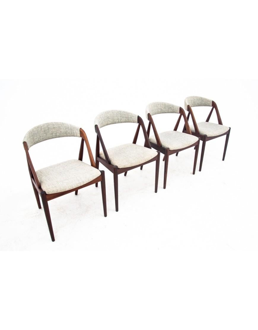 A set of 4 iconic teak chairs model 31 designed by Kai Kristiansen. Made in Denmark in the 1960s.

Excellent condition after renovation and replacement of upholstery. An icon of Scandinavian design from the mid-20th century.

dimensions: height 75