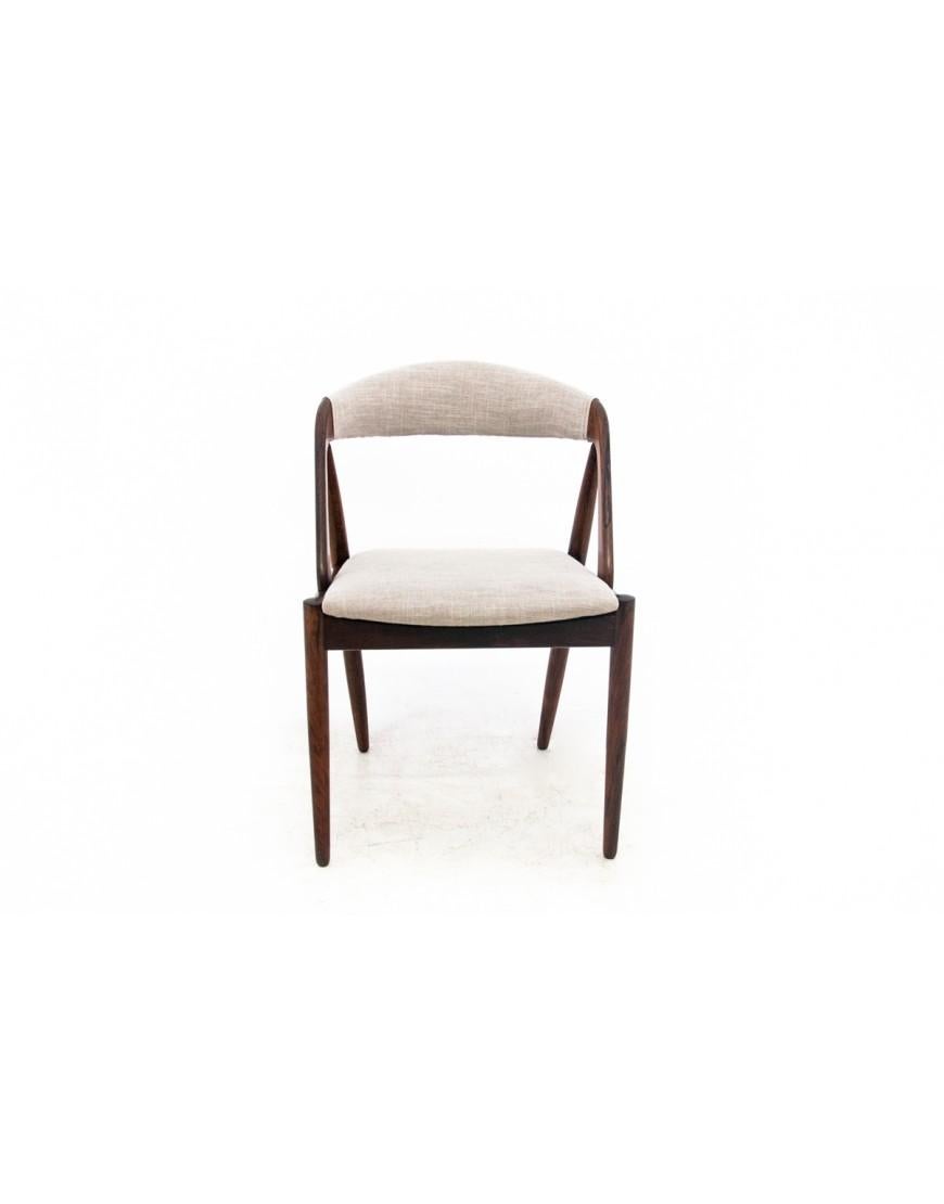 A set of 4 iconic teak chairs model 31 designed by Kai Kristiansen. Made in Denmark in the 1960s.

Excellent condition after renovation and replacement of upholstery. An icon of Scandinavian design from the mid-20th century.

dimensions: height 75