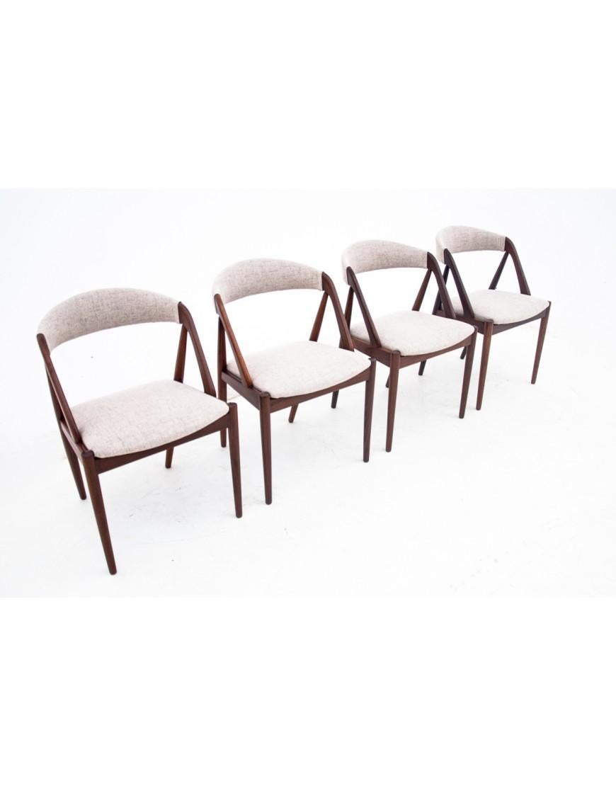 Set of 4 iconic teak chairs model 31 designed by Kai Kristiansen. Manufactured in Denmark in the 1960s. 

Excellent condition after renovation and replacement of upholstery. Wooden elements have been cleaned and finished with durable varnish.