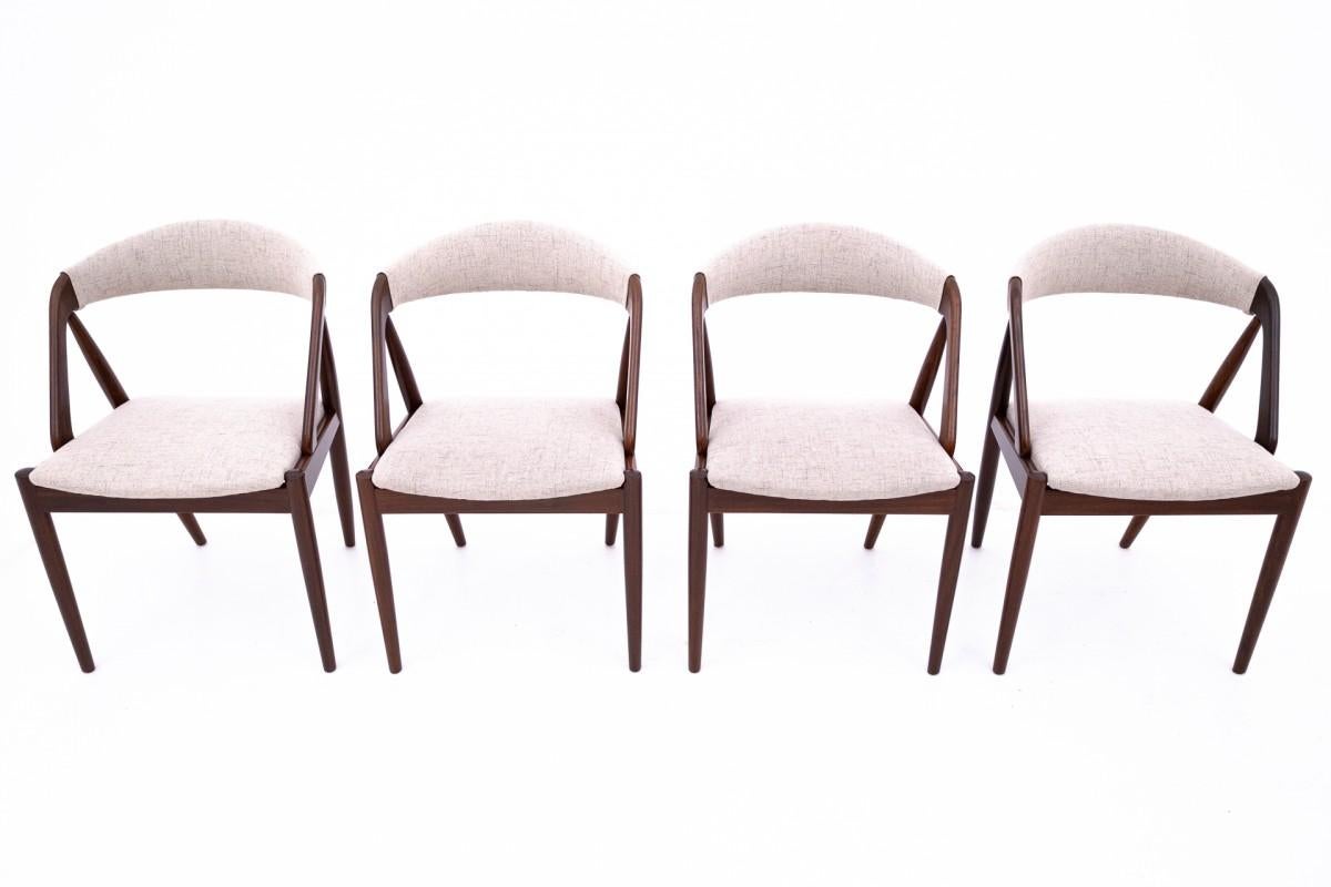 Set of 4 iconic teak chairs model 31 designed by Kai Kristiansen. Manufactured in Denmark in the 1960s. 

Excellent condition after renovation and replacement of upholstery. Wooden elements have been cleaned and finished with durable varnish.