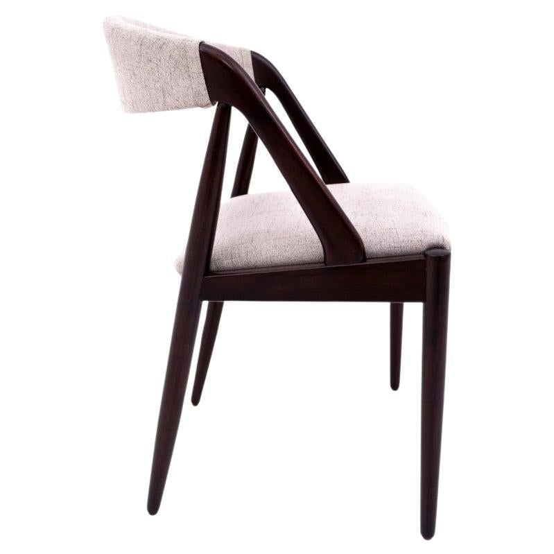 Set of 4 iconic teak chairs model 31 designed by Kai Kristiansen. Manufactured in Denmark in the 1960s. 

Excellent condition after renovation and replacement of upholstery. Wooden elements have been cleaned and finished with durable varnish.