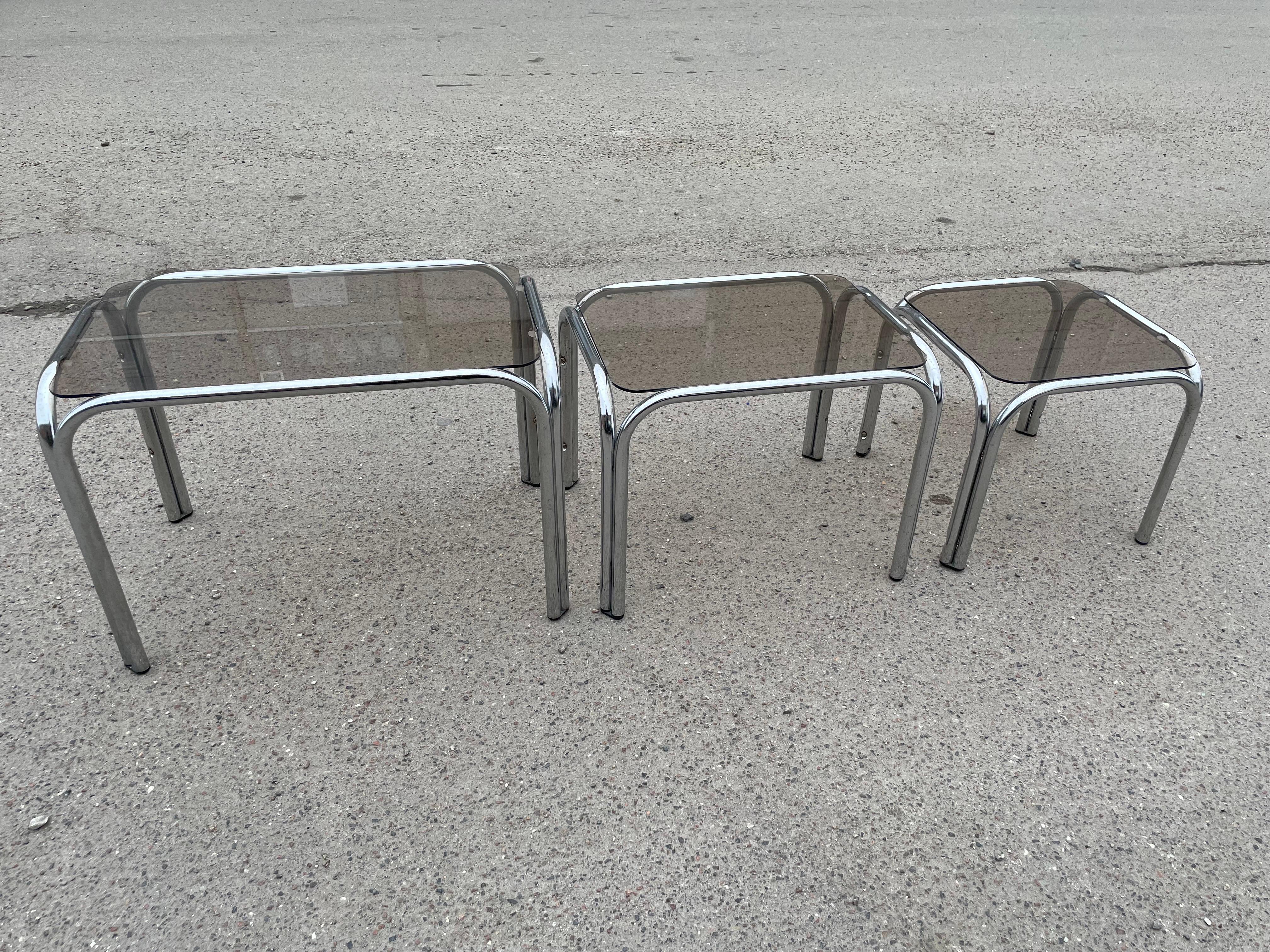 Italian A set of Chrome and Smoked Glass nesting tables 1970’s  For Sale