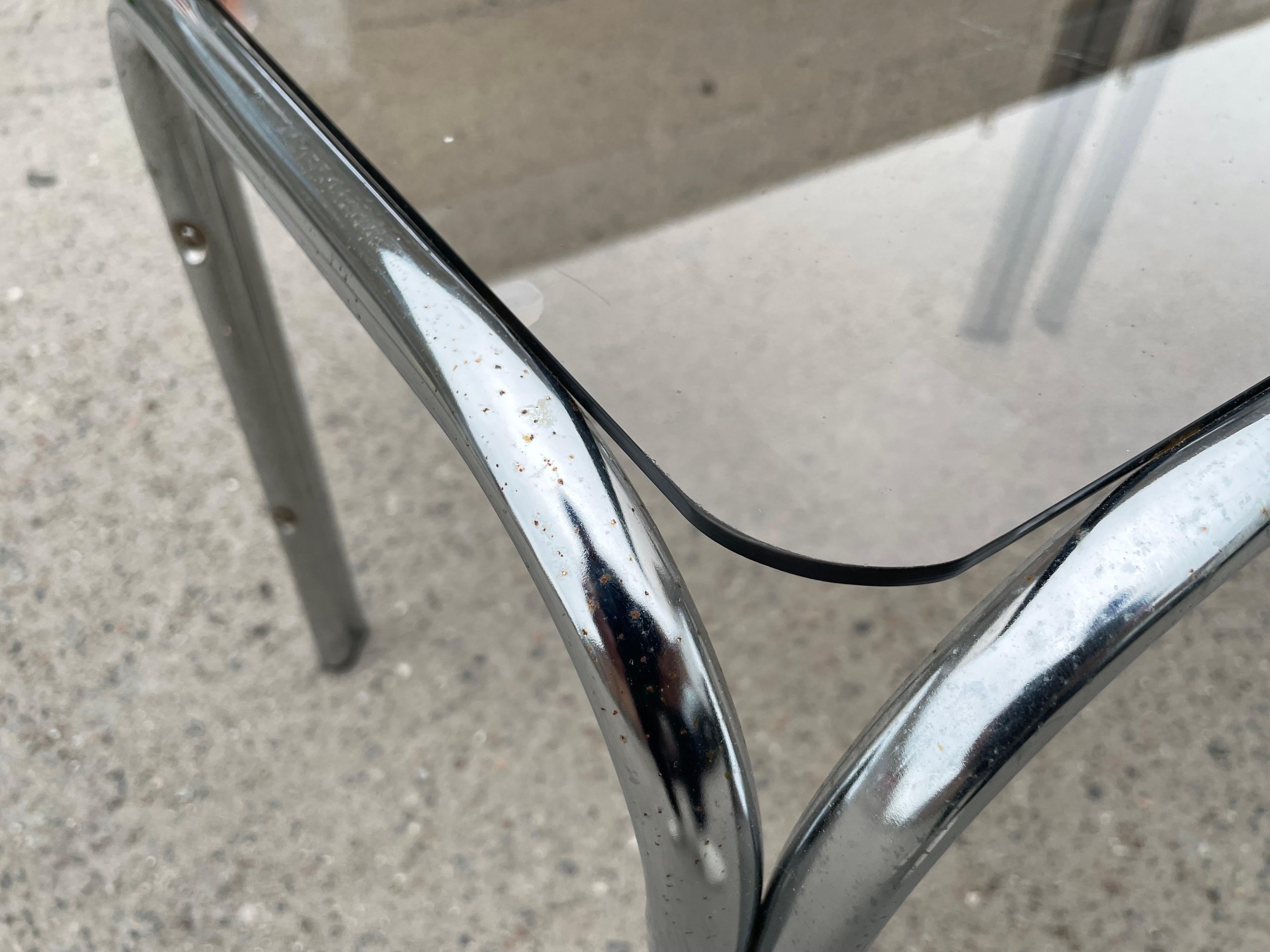 Late 20th Century A set of Chrome and Smoked Glass nesting tables 1970’s  For Sale