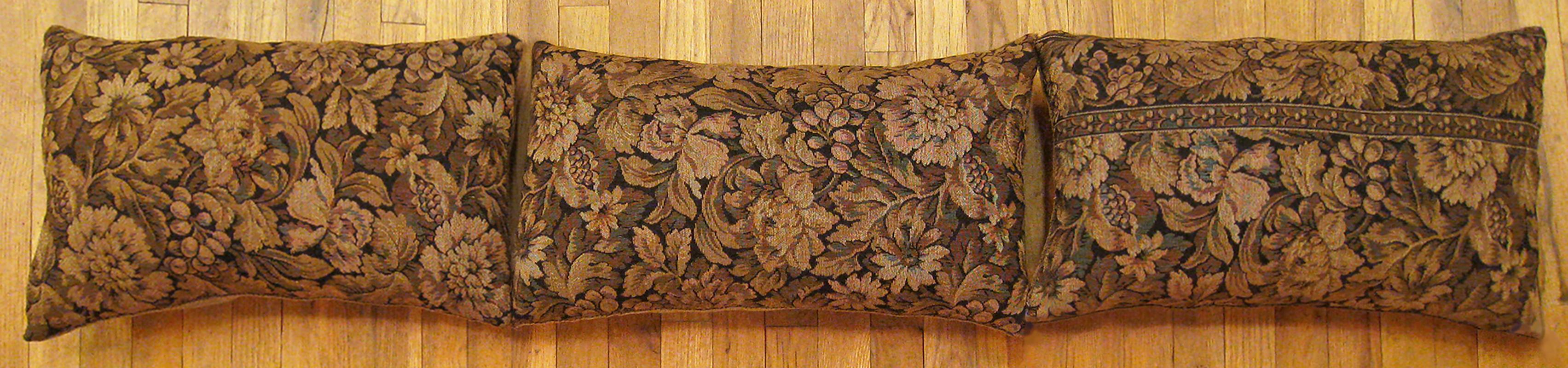 A set of antique french tapestry pillows ; size 24” x 14” (2’ 0” x 1’ 2”) each. 

An antique decorative pillows with floral elments allover a brown central field, size 24” x 14” (2’ 0” x 1’ 2”) each. This lovely decorative pillow features an