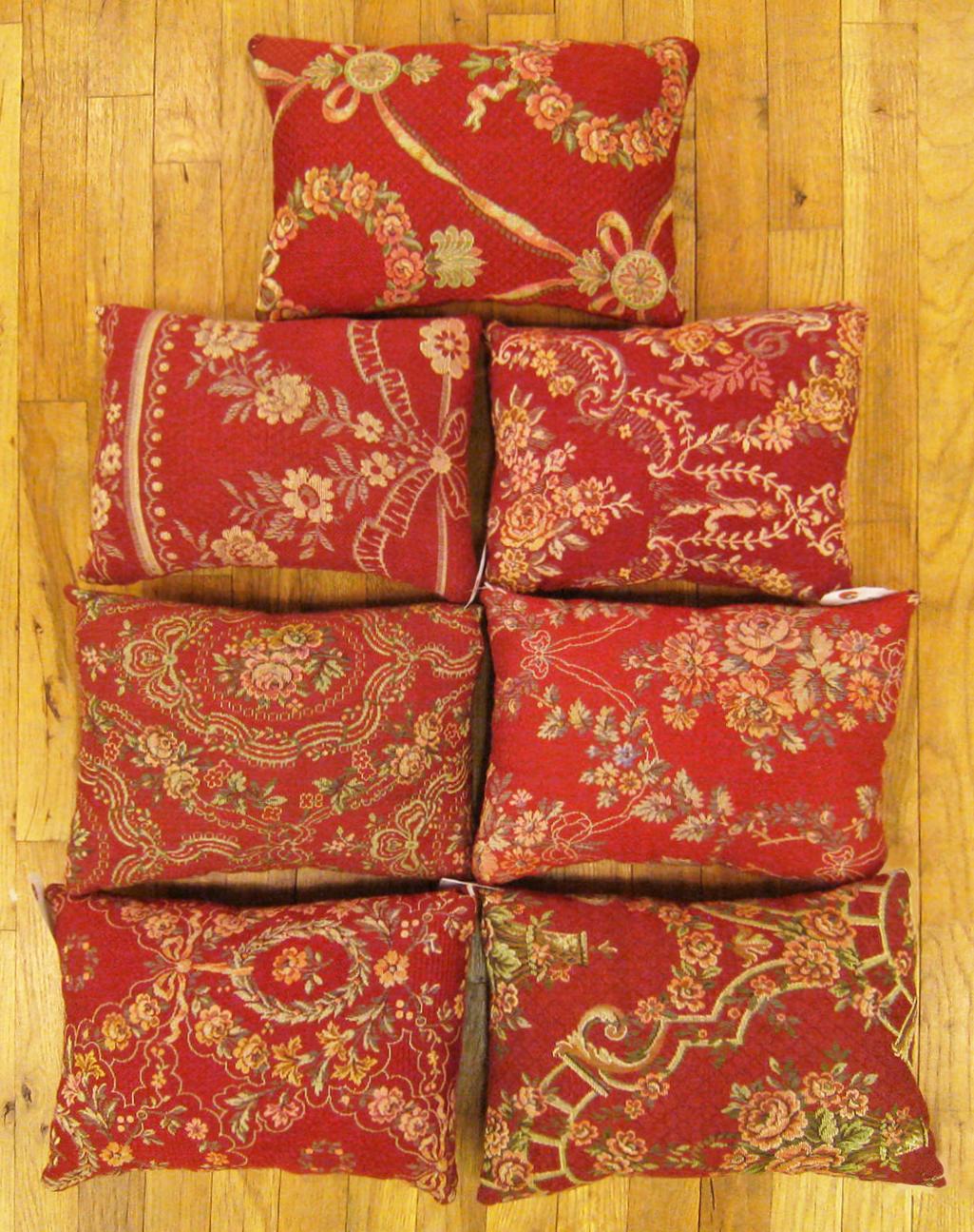A Set of Antique Jacquard Tapestry Pillows ; size 1'0” x 1'3” and 1'0” x 1'2” and 1'0” x 1'3”.

An antique decorative pillows with floral elements allover a red central field, size 1'0