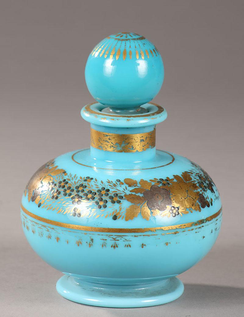 A set of 4 opaline perfume bottles from the early 19th century; decoration was executed by Jean-Baptiste Desvignes. 
- One small perfume bottle in turquoise opaline with its ball shaped cork, decorated with a wreath of anemones and forget-me