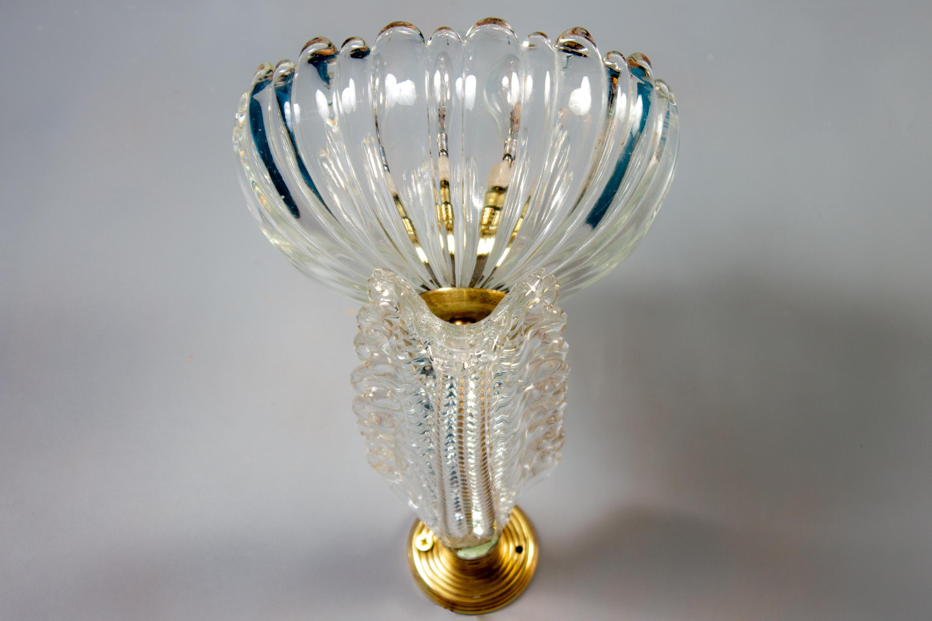 A rare set of eight Barovier Art Deco brass mounted Murano glass sconces or wall lights wit a precious hand blown Murano glass cup. 
We can sell also a pair. 
Each with 1 E24 light bulb.