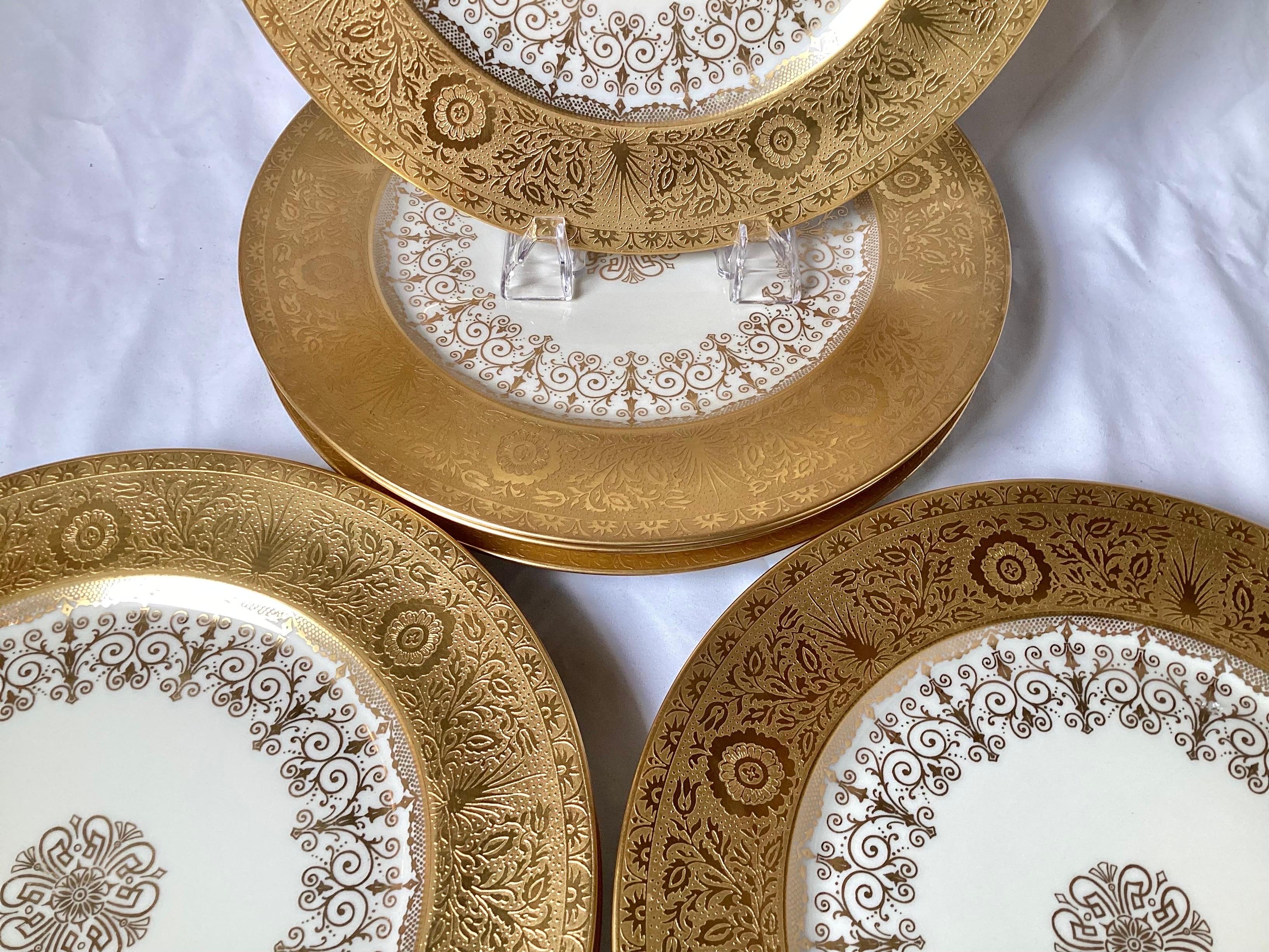 Porcelain Set of Eight Gold Encrusted Service Dinner Plates