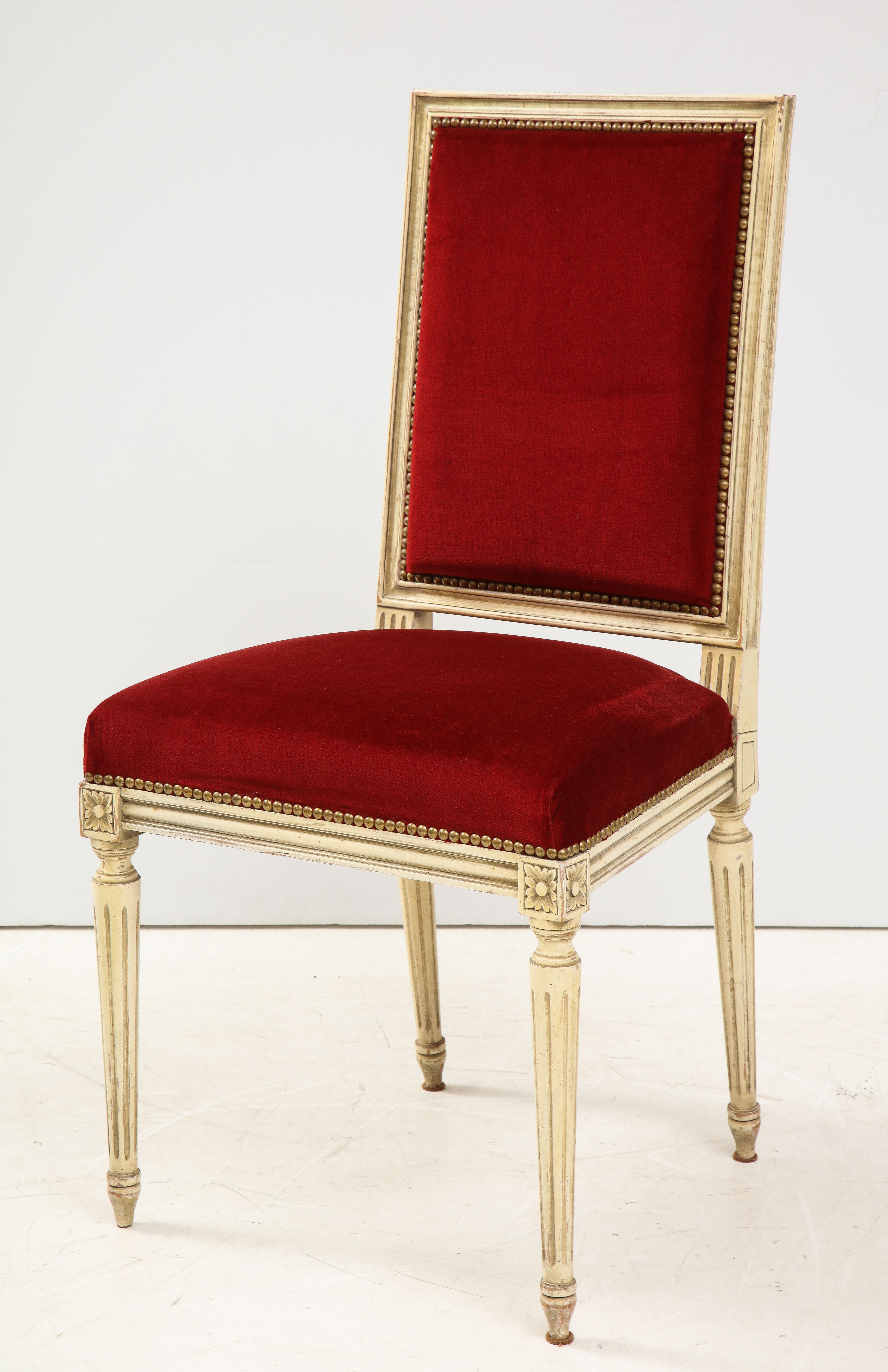 We will never tire of Louis XVI style dining chairs, as their clean lines and timeless elegance, can enhance both traditional and contemporary interiors. These eight, upholstered in red velvet with a painted finish, feature many of the lovely