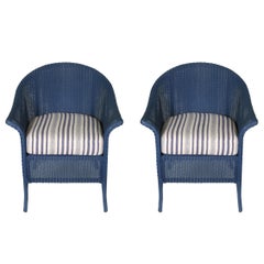 A Set of Eight Navy Wicker Dining Chairs with Cushions