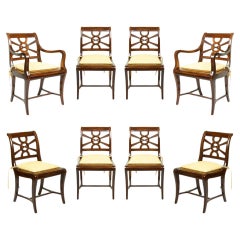 A Set of Eight Regency Style Mahogany and Caned Dining Chairs