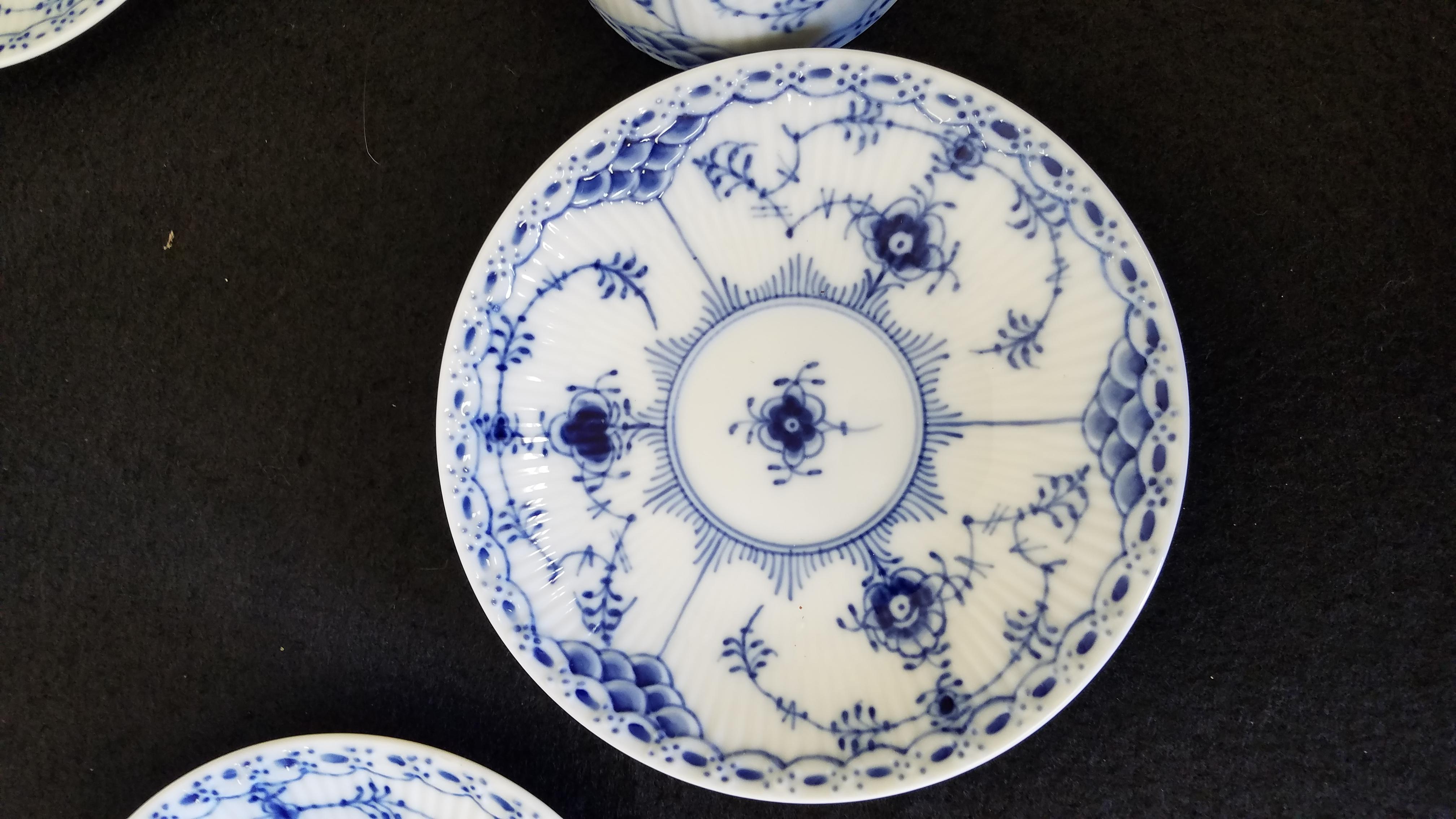 A set of eight royal Copenhagen porcelain espresso cups and saucers in the most desirable half lace pattern. Each one clearly marked on the underside.