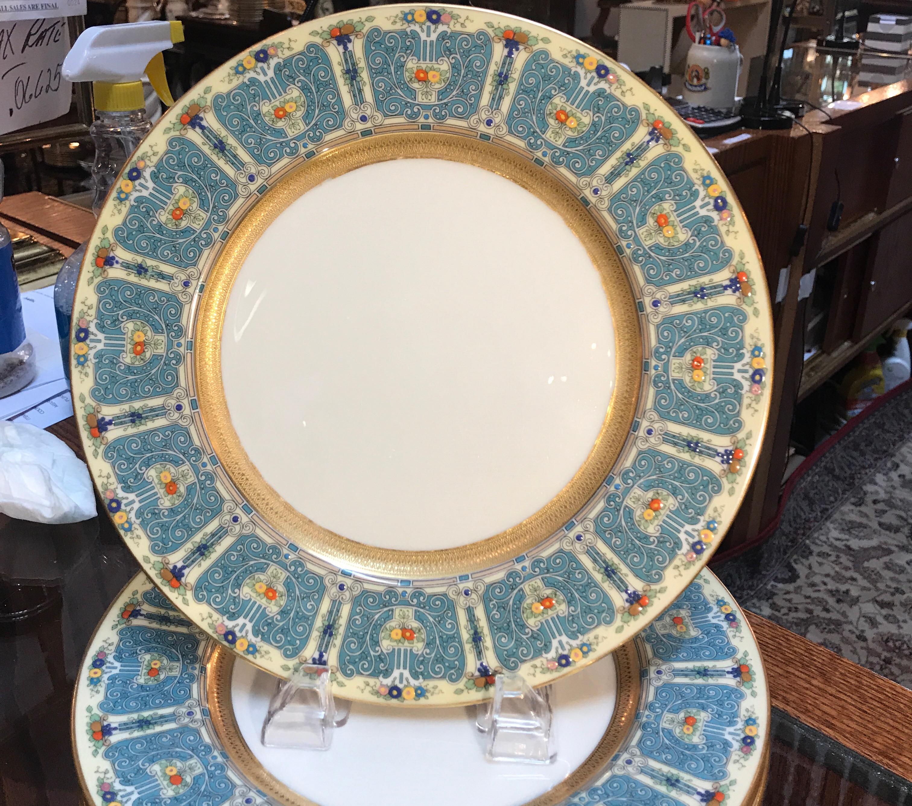 A set of 11 elegant hand enameled early 20th century dinner service plates by Lenox. Early Lenox with a green mark (pre 1930) was beautifully hand crafted and considered the best American made dinnerware and gift ware.