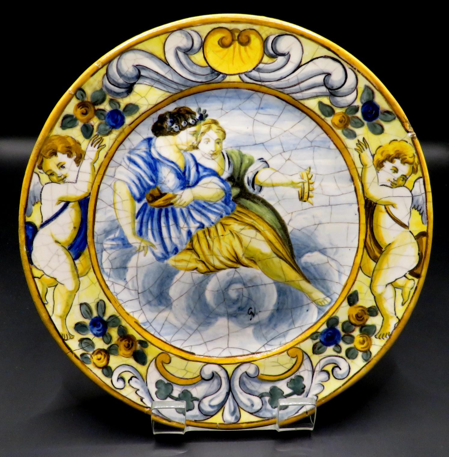 All eleven of these very charming cabinet plates having crazed bodies with hand painted mythological & romantic vignettes, surrounded by borders decorated with foliate designs interspersed with cherubs & masks. 
All  signed  with artists monogram CM