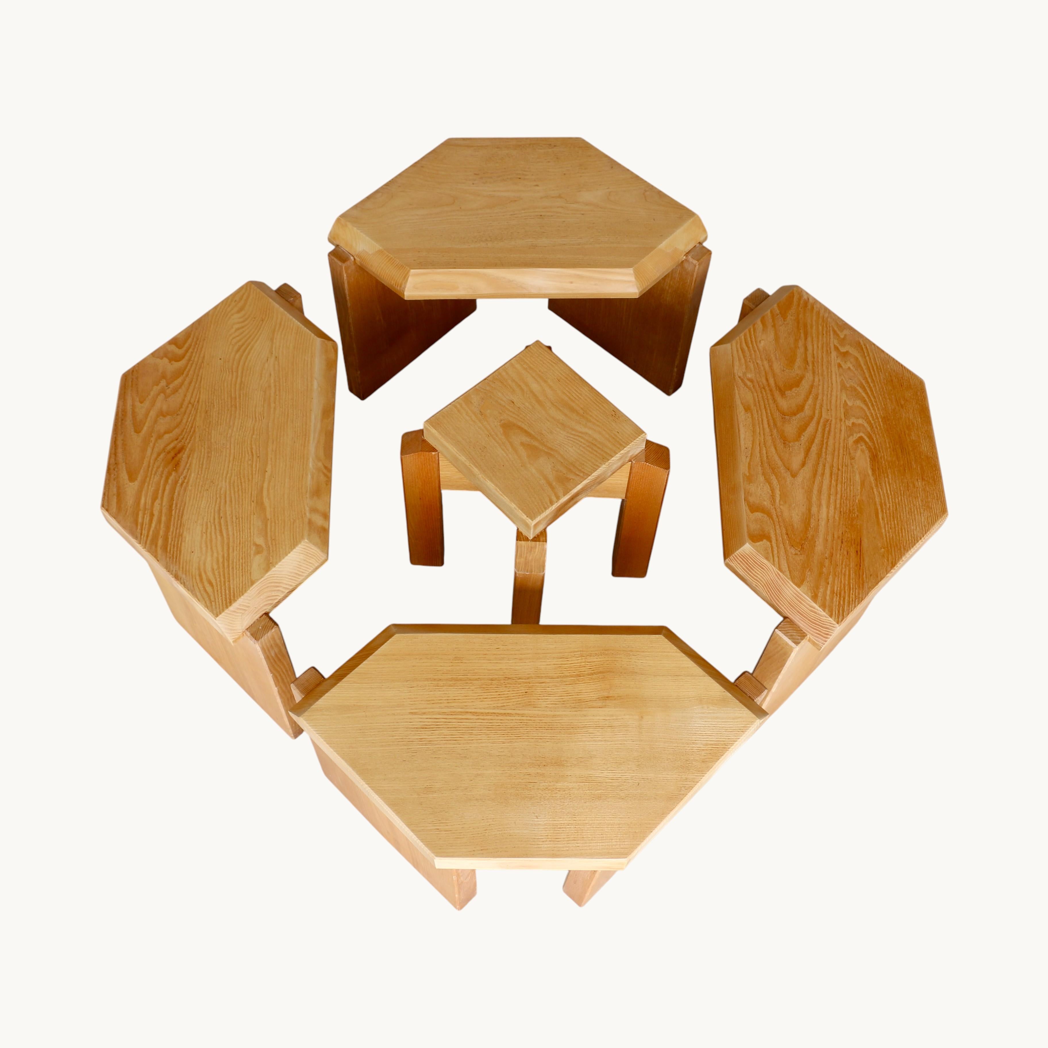 A set of five modular coffee tables in solid light oak. France 70s.