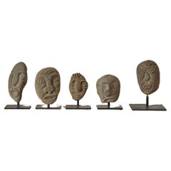 A Set of Five Stone Face Sculptures by David George Marshall