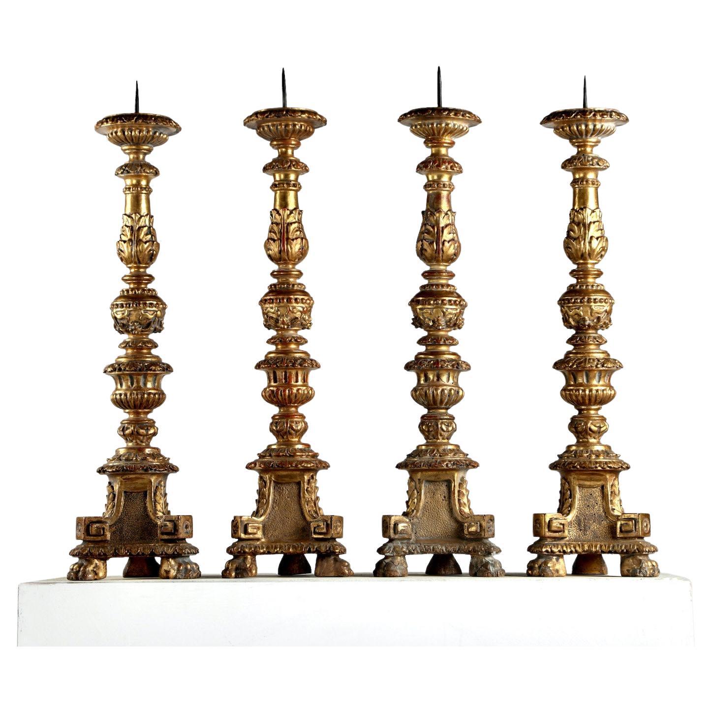 A Set of Four 18th Century Candlesticks