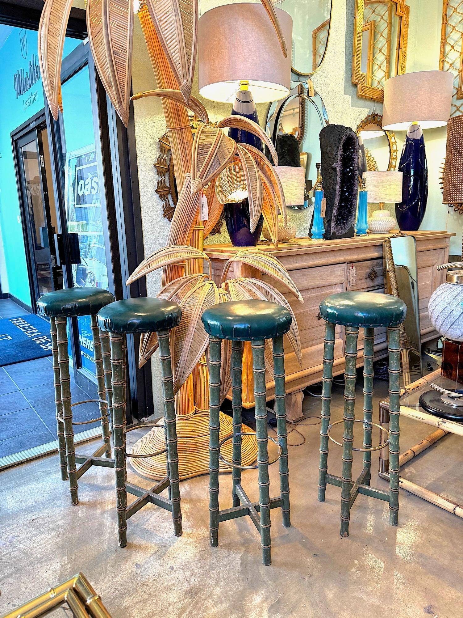 A set of 4 1950s Spanish Faux bamboo wooden and brass stools with orignal seat pads