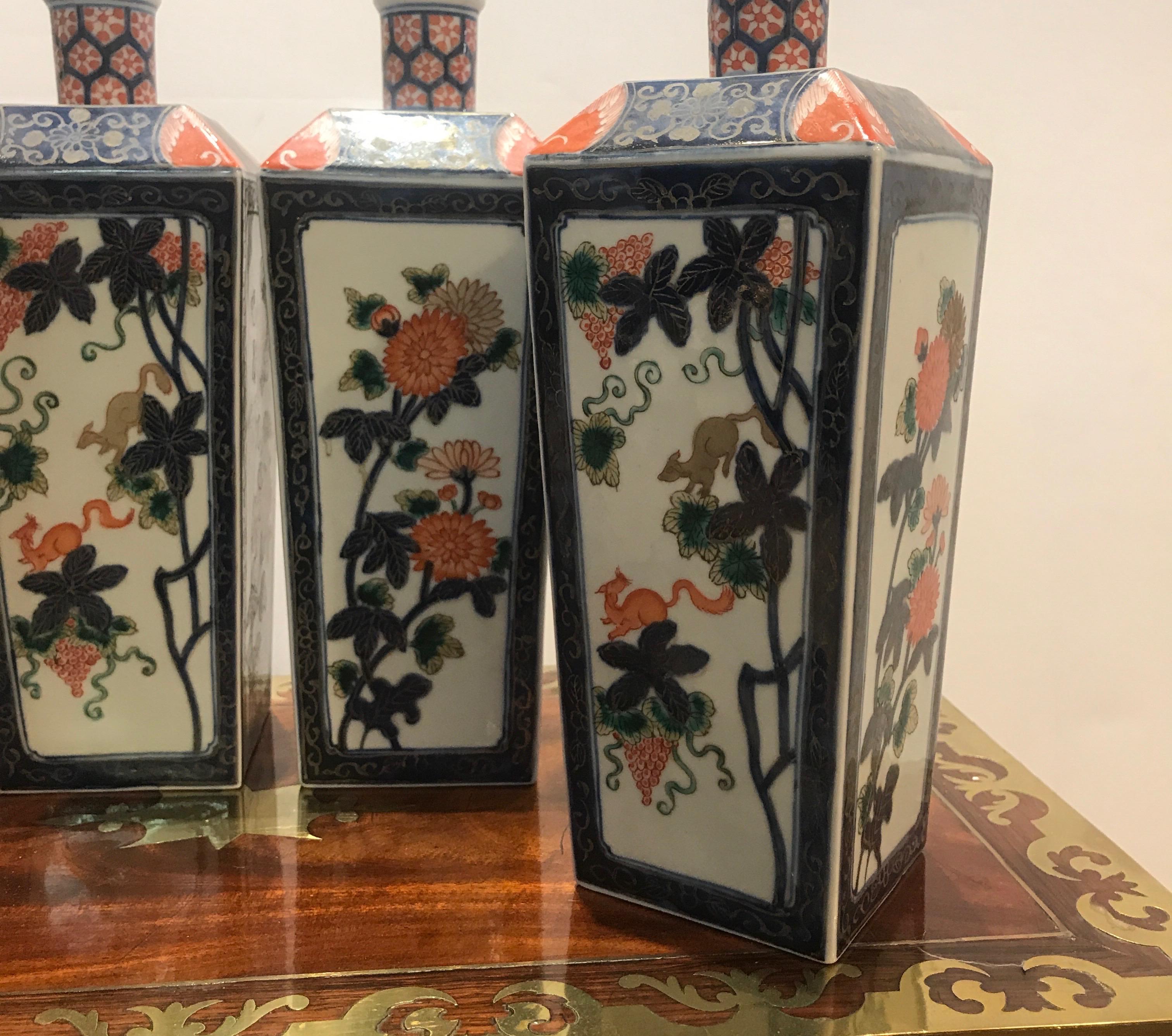 Hand-Painted Set of Four Antique Imari Bottle Vases Meiji Period
