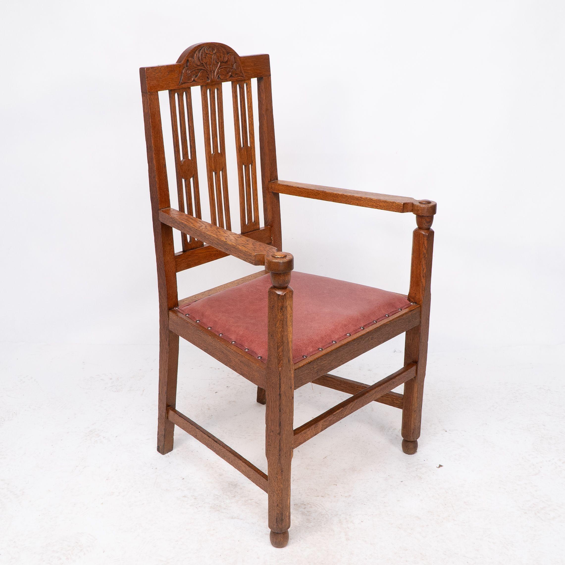Hand-Carved A set of four Arts and Crafts dining chairs with nicely carved floral decoration For Sale