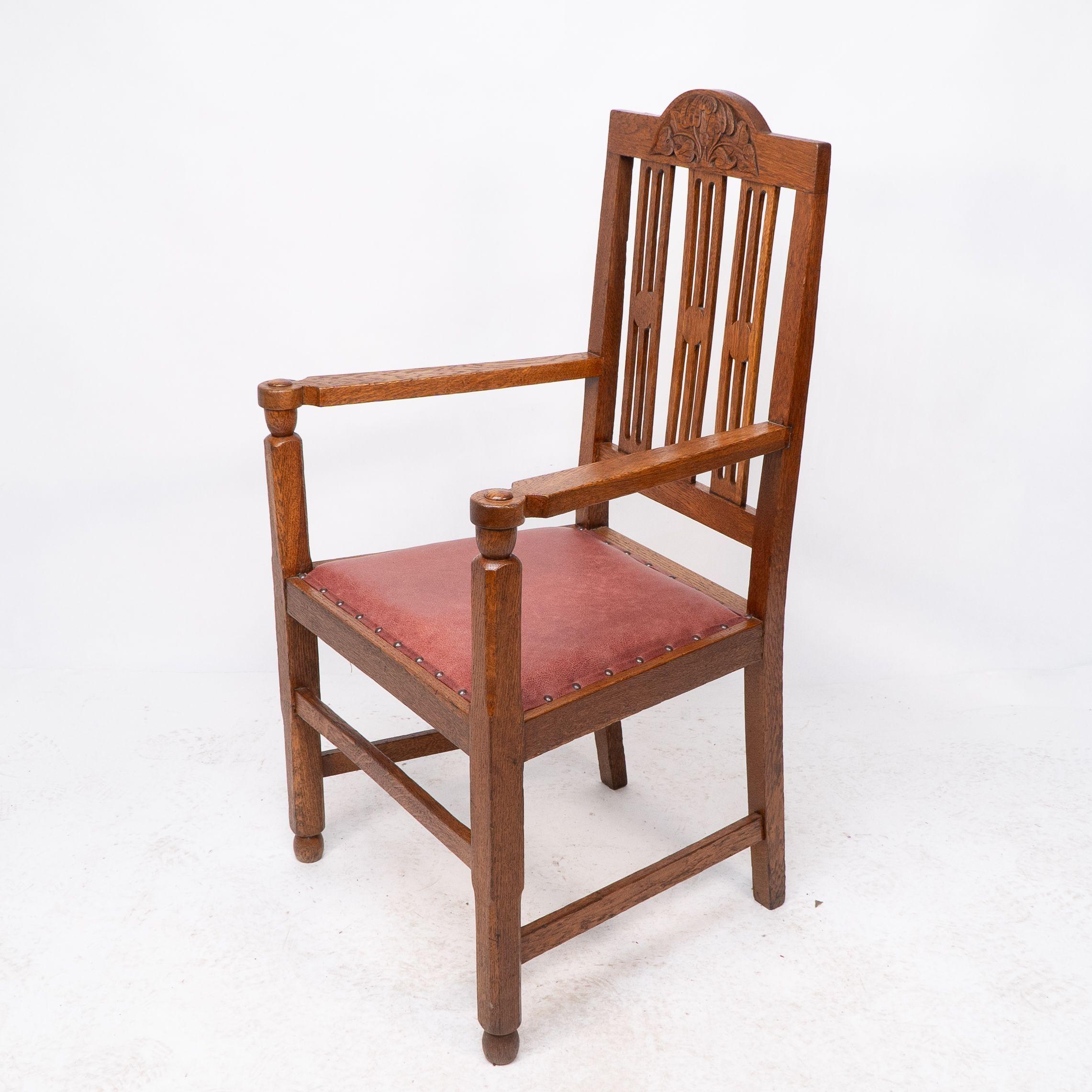 Early 20th Century A set of four Arts and Crafts dining chairs with nicely carved floral decoration For Sale