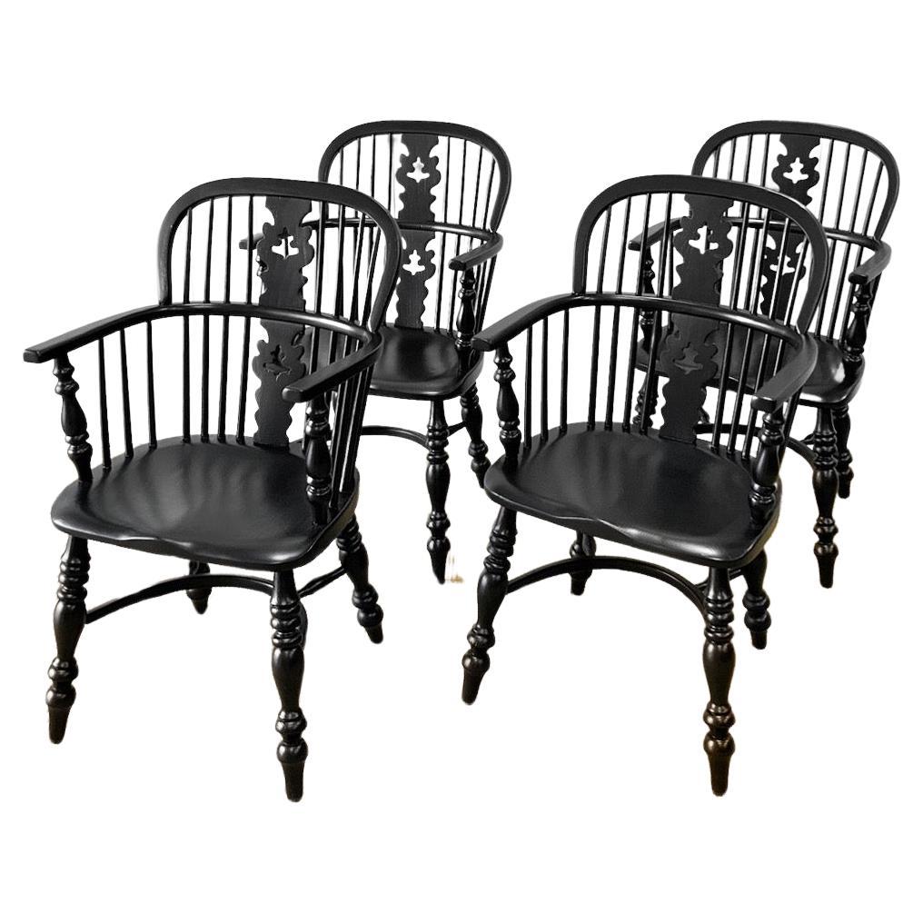 A Set of Four Black Windsor Armchairs