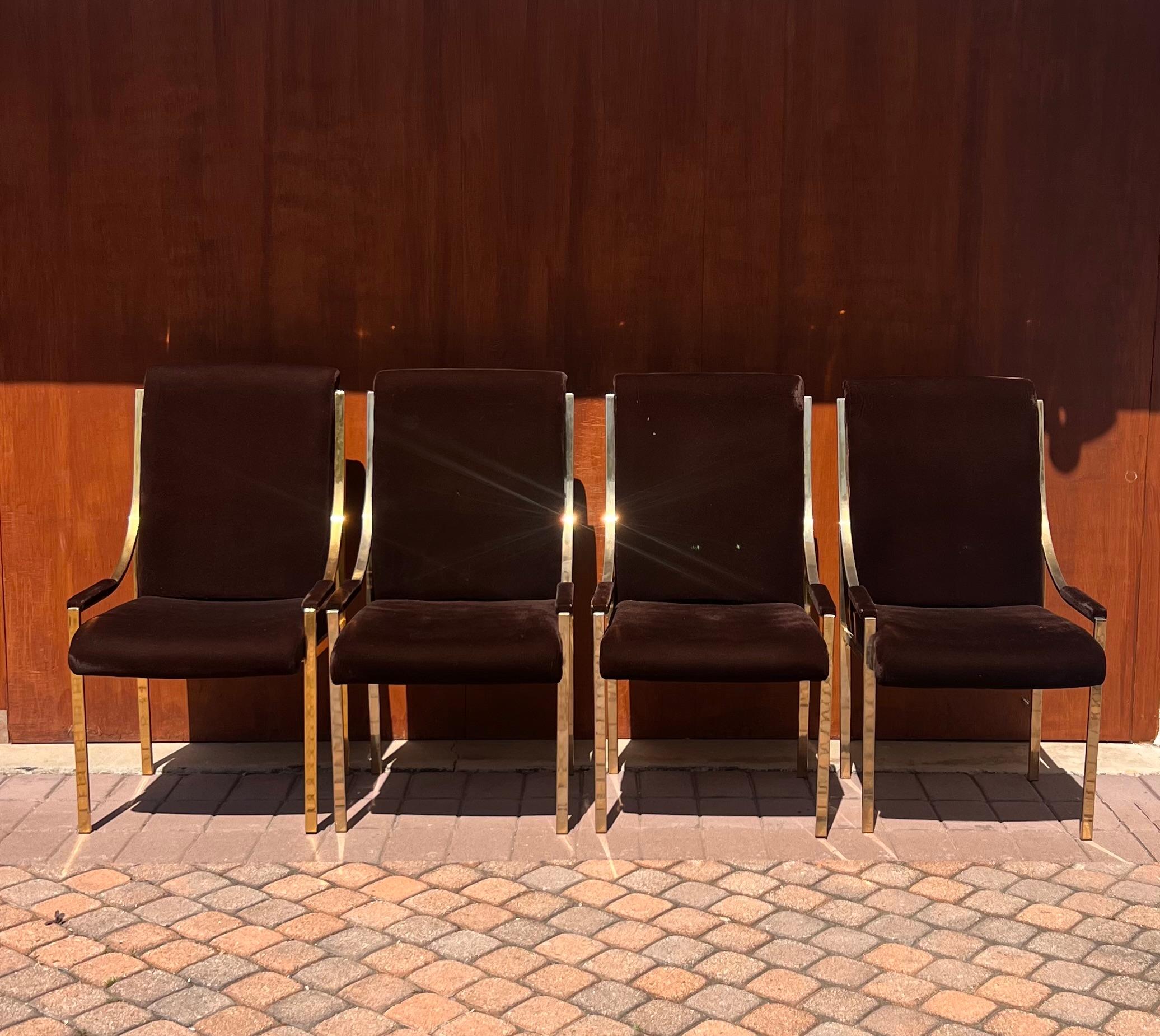 A gorgeous and glamorous set of chocolate brown velvet and brass dining chairs, made in Canada circa 1970s. The chairs are marked “Sheres” and “made in Canada” on verso of the seat. The stunning gilt of the metal creates cinematic light refractions